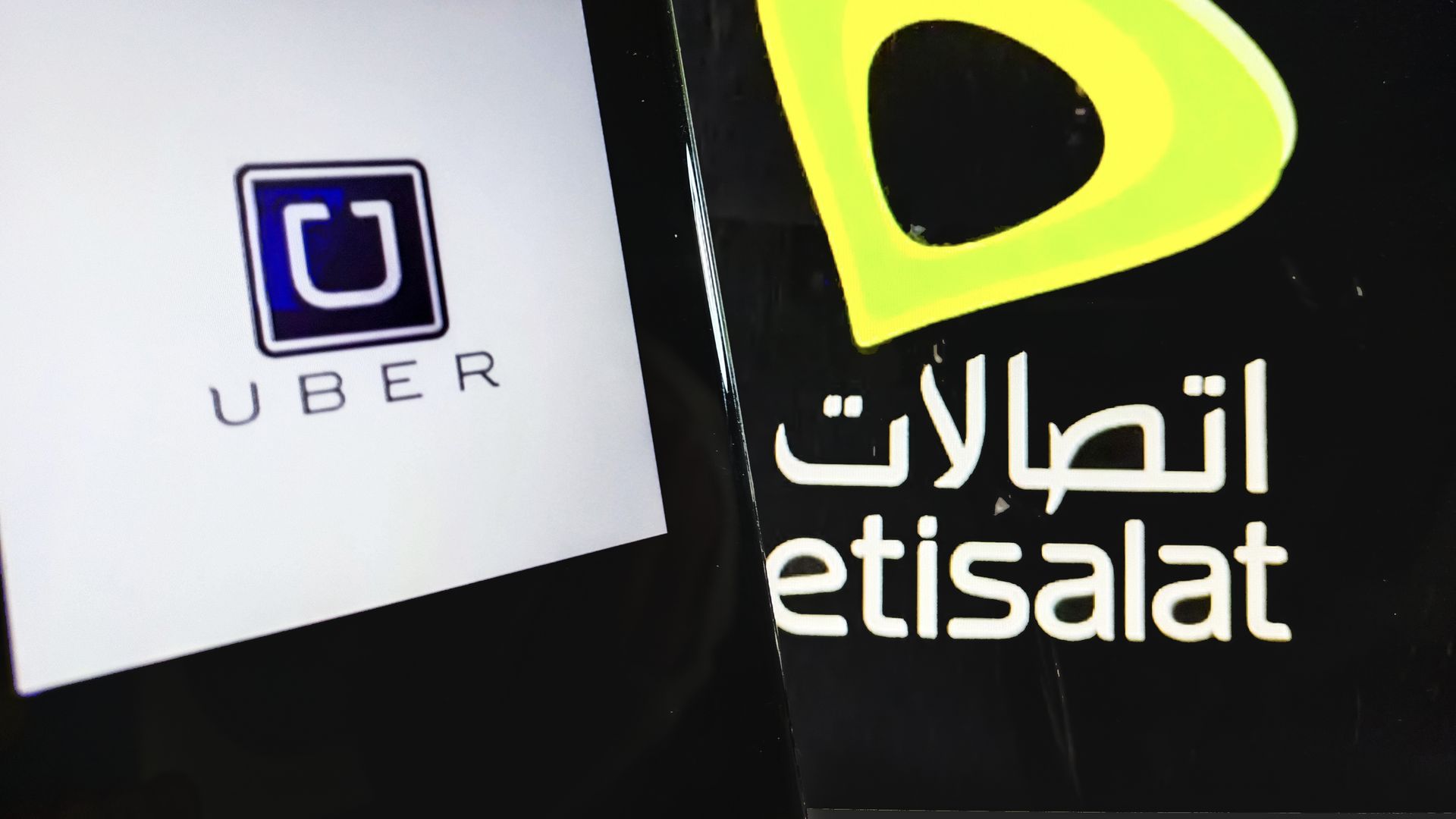 Logos of Uber and Etisalat.