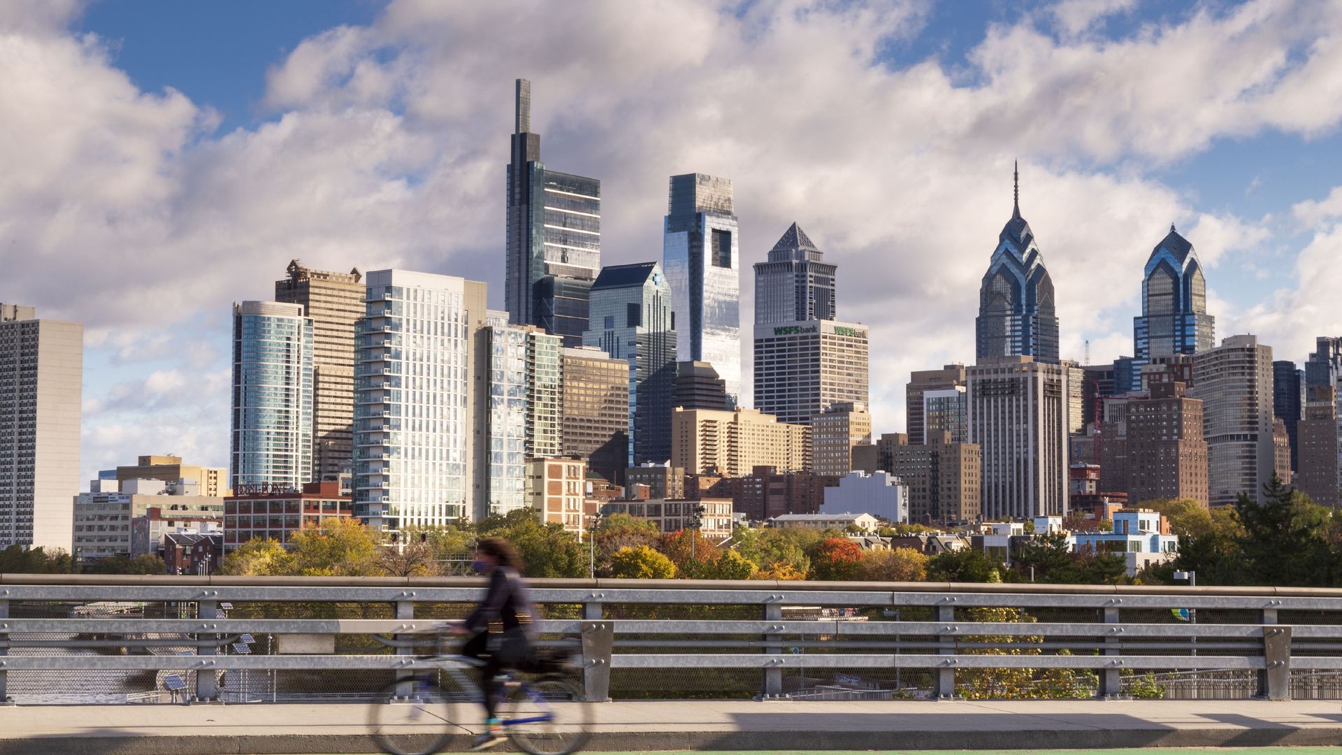 The Philadelphia skyline with cyclist on South Street Bridge on Oct. 31, 2020. Photo: Jumping Rocks/ Getty