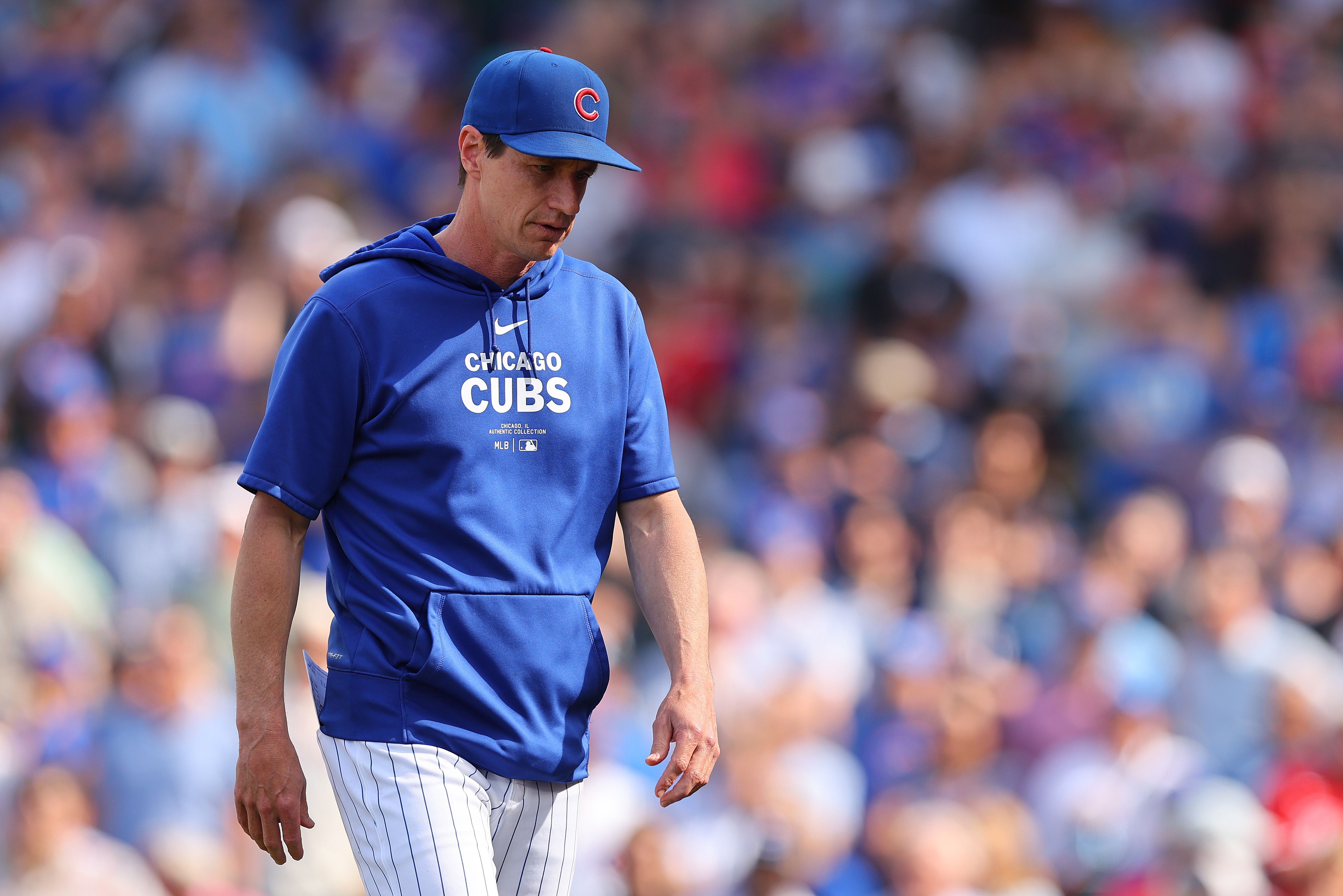 Photo of a manager walking off a baseball field