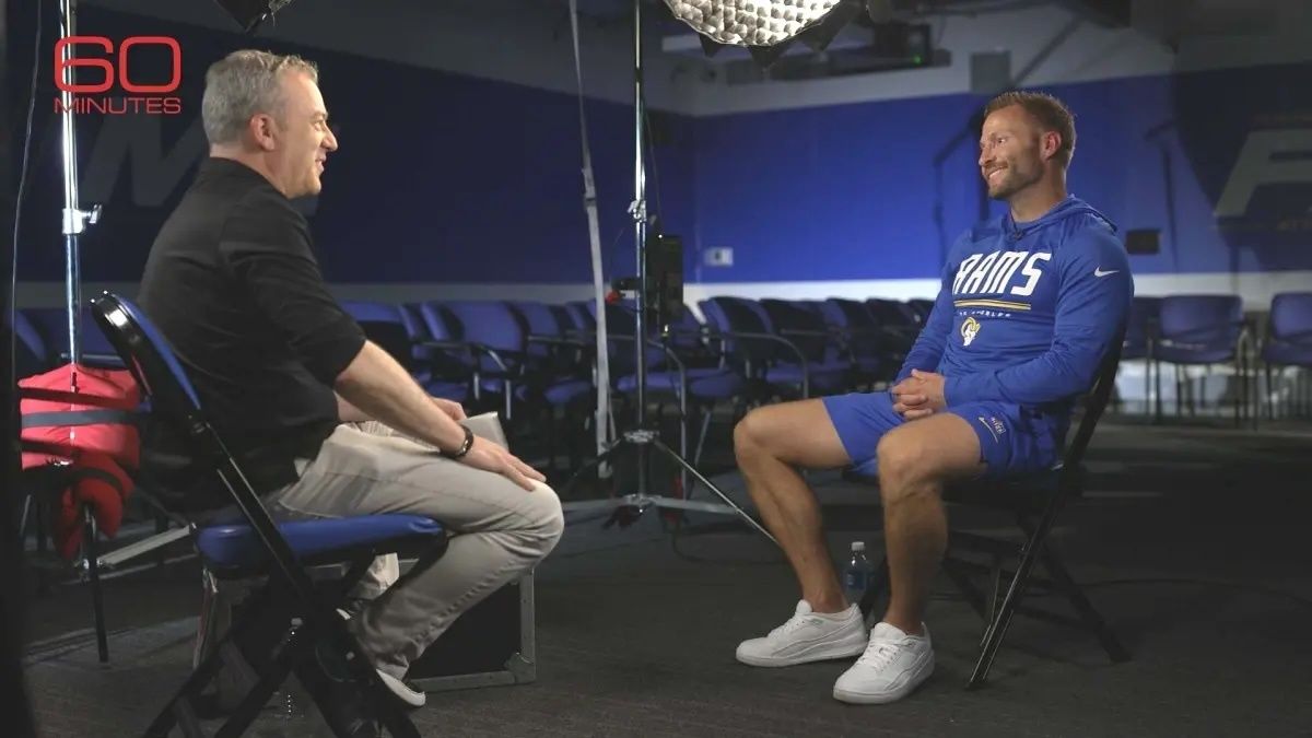 Wertheim and McVay sit across from one another in an interview setting