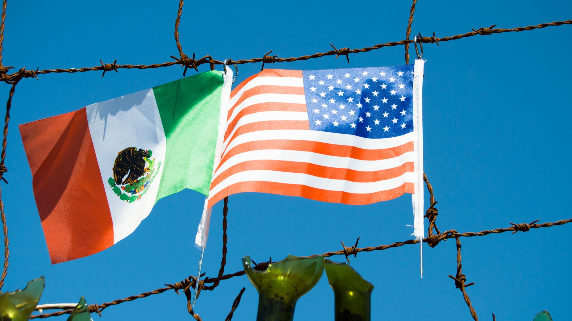 Mexican and American flags at the southern border