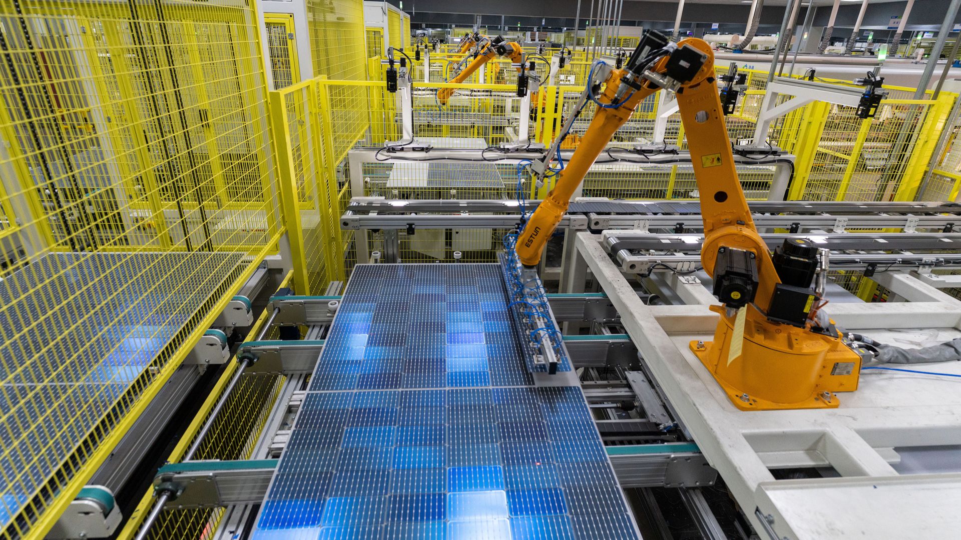  Robotic arms work on the production line of solar panels at a factory of GCL System Integration Technology Co. Ltd on September 15, 2022 in Feidong County, Hefei City, Anhui Province of China. 