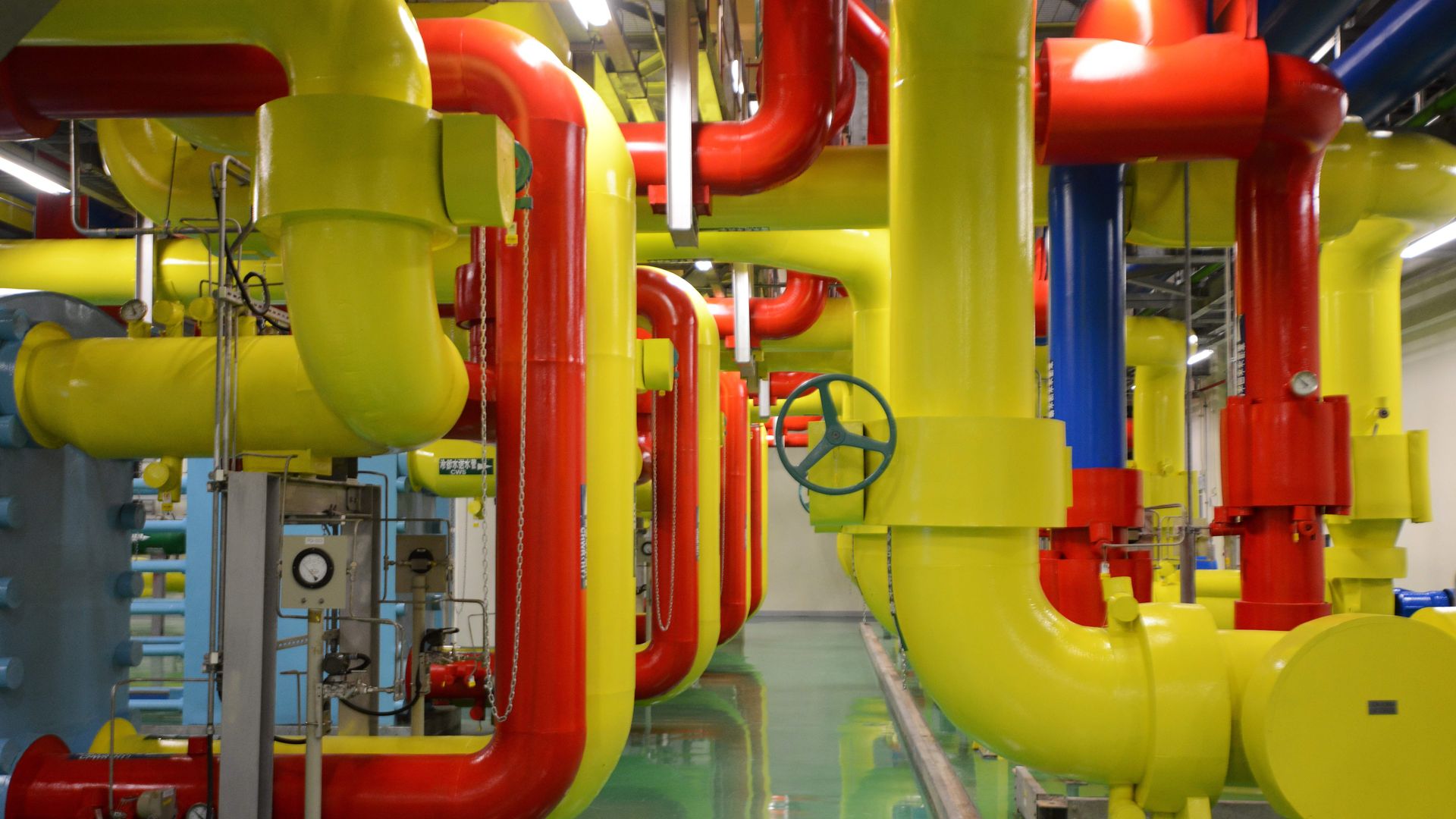 Red and yellow plumbing inside a Google data center. 