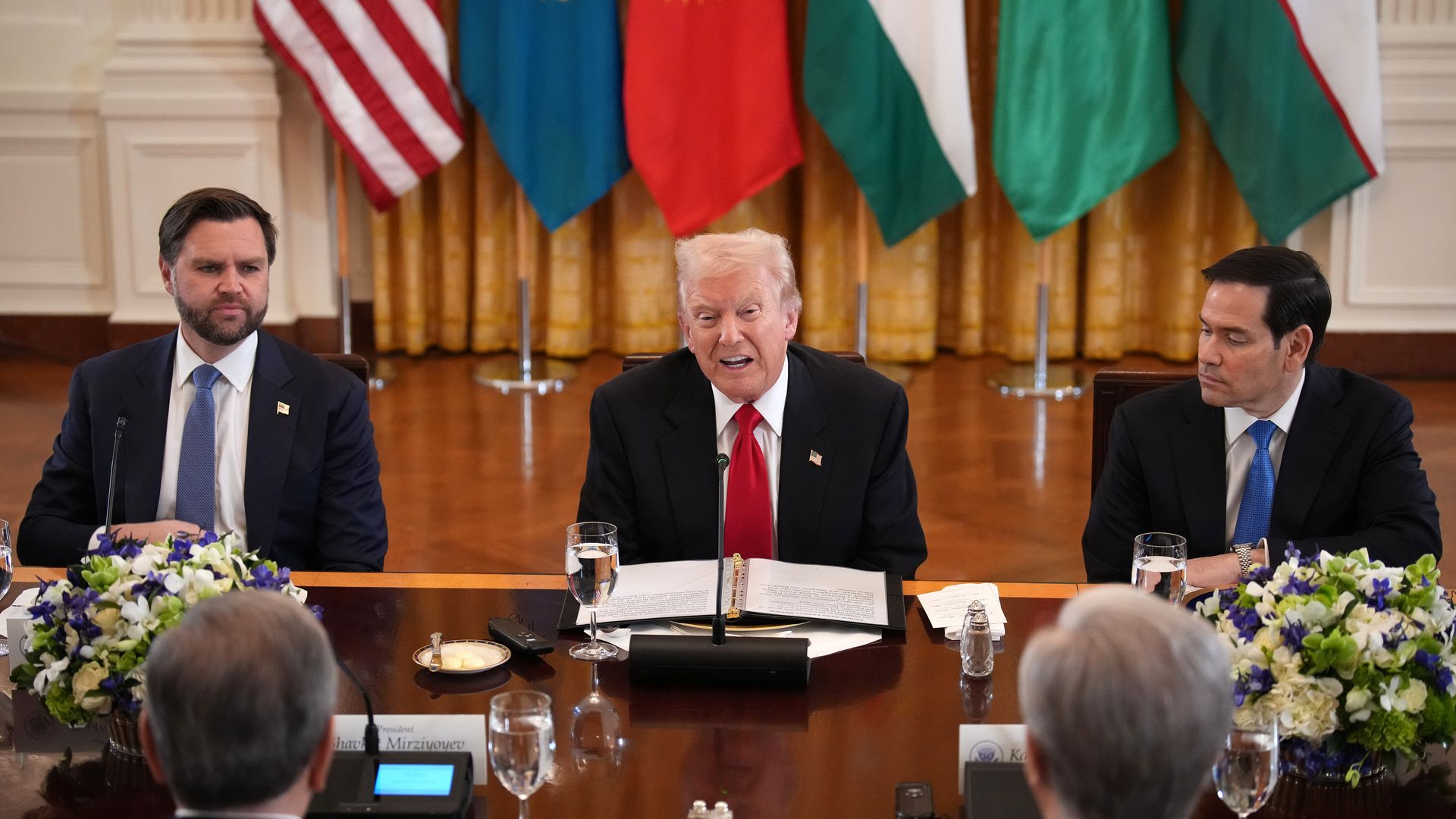 Vice President Vance, President Trump and Secretary of State Marco Rubio sit behind a table.