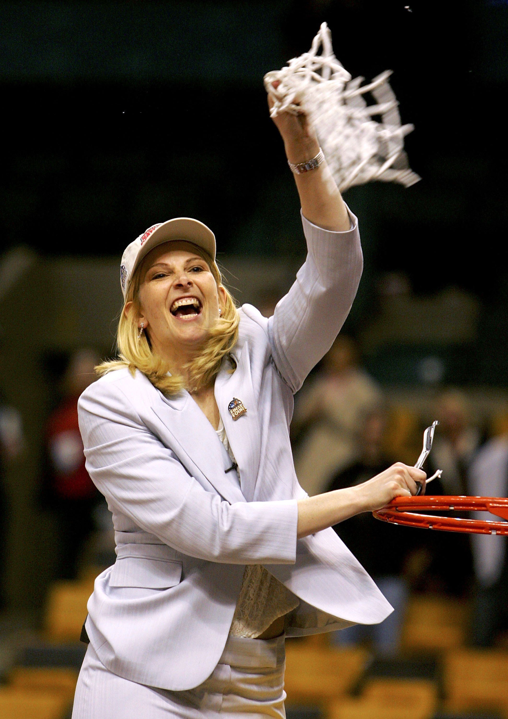 Head coach Brenda Frese of the Maryland Terrapins celebrates as she cuts down the net after defeating the Duke Blue Devils 78-75 in overtime in the 2006 NCAA Women's Basketball Championship Game on April 4, 2006 at the TD Banknorth Garden in Boston, Massachusetts. (Photo by Jim McIsaac/Getty Images)
