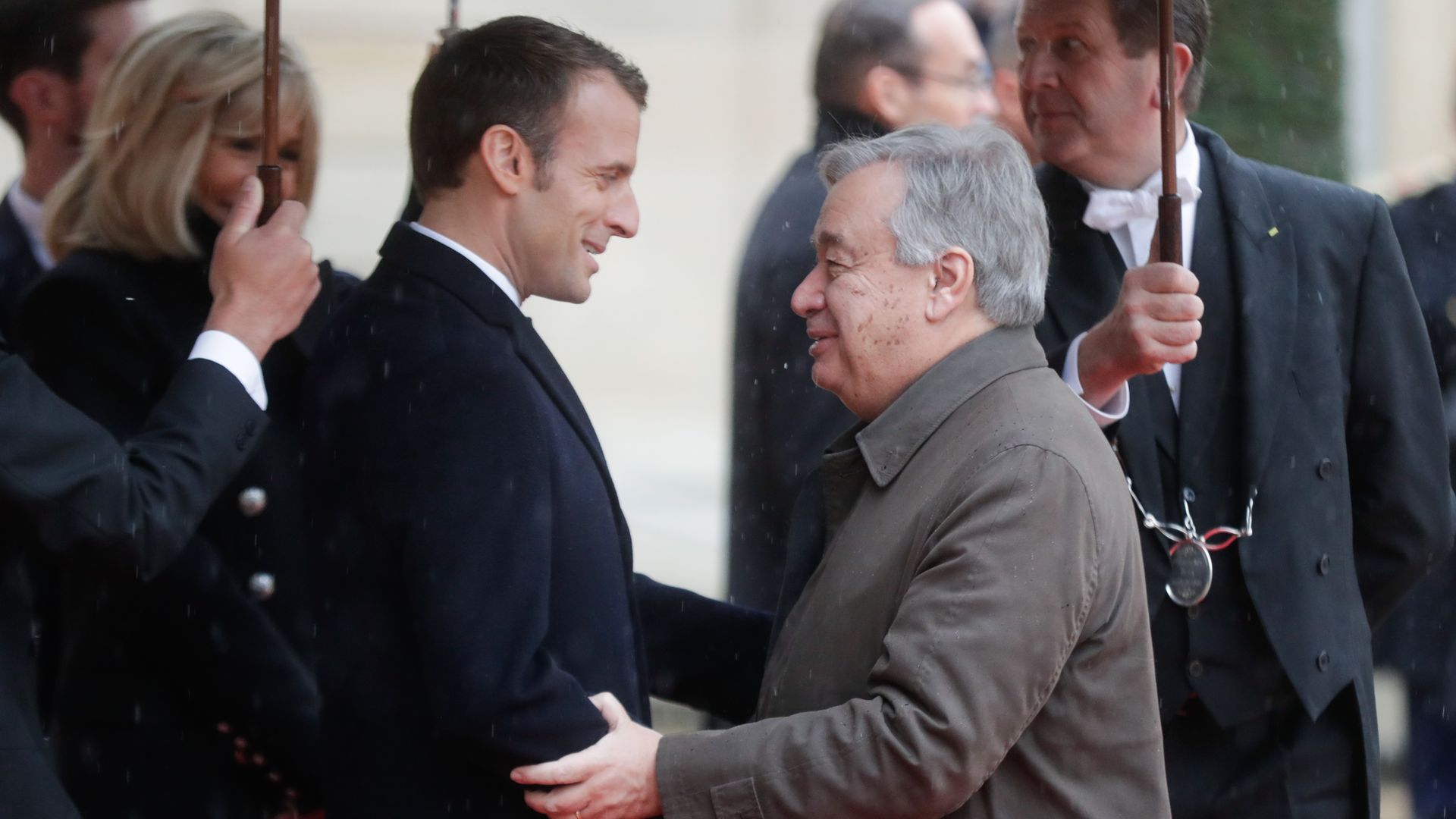 Macron shaking hands with Antonio Guterres