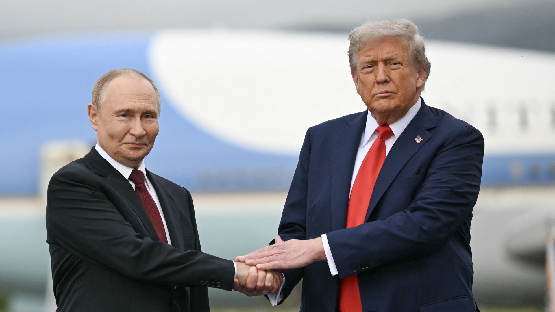 Trump and Putin meet on the tarmac after arriving at Joint Base Elmendorf-Richardson in Anchorage.