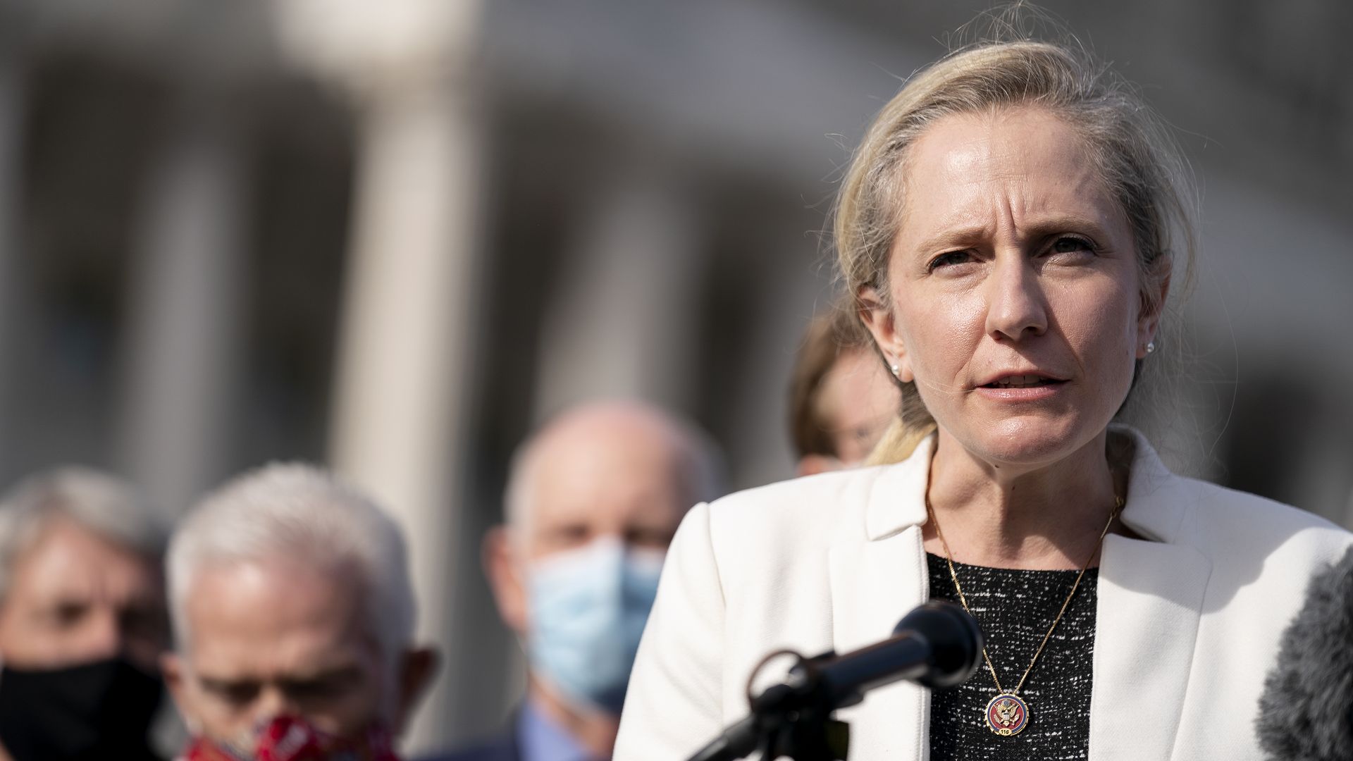 Rep. Abigail Spanberger is seen speaking in front of the U.S. Capitol.