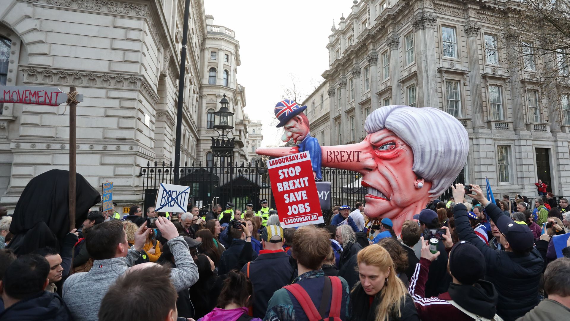 A puppet head of Britain's Prime Minister Theresa May spearing a representation of the British Economy is positioned on Whitehall outside Downing Street