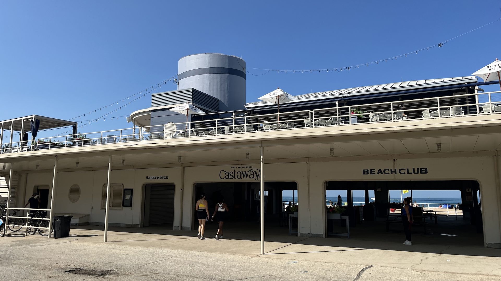 A building that looks like a shipwreck that's turned into a bar and beach club.