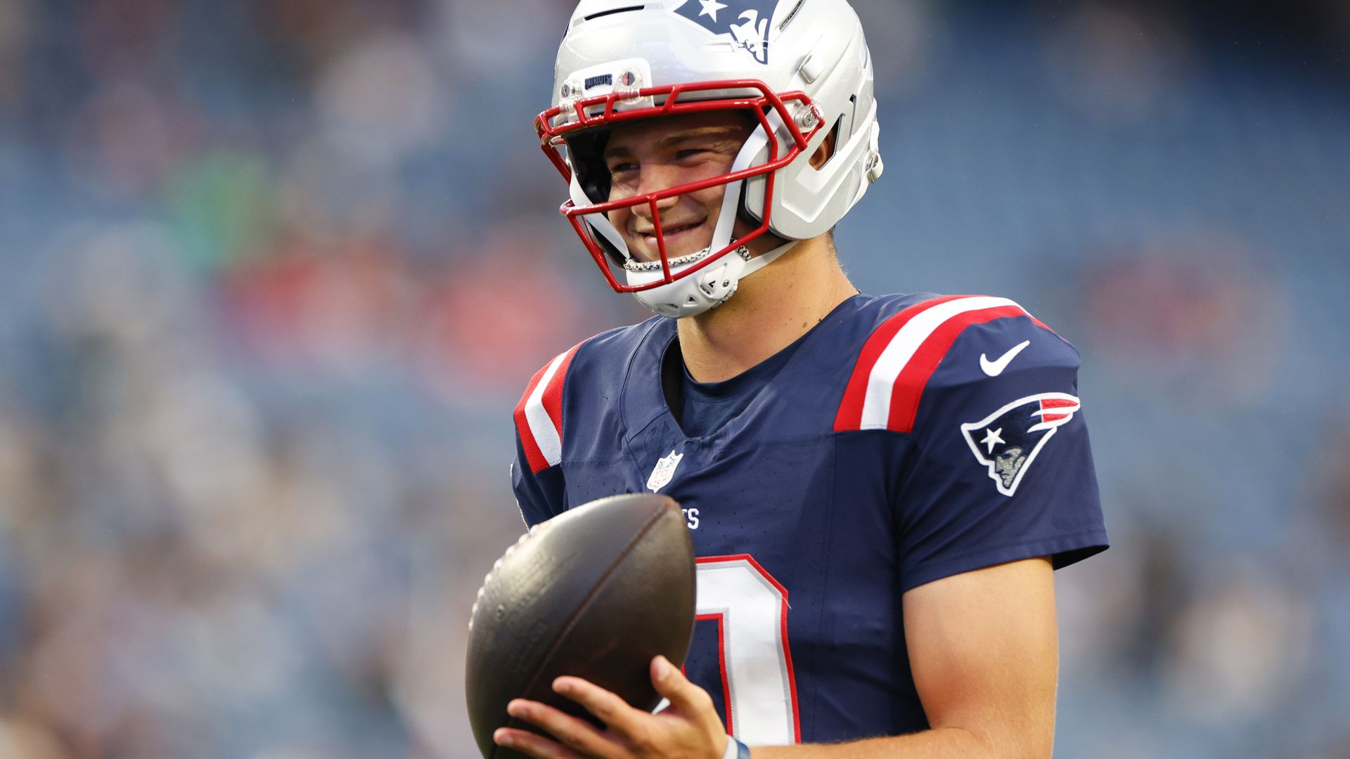 New England Patriots quarterback Drake Maye smiles during warmups. The New England Patriots played the Philadelphia Eagles in a preseason game at Gillette Stadium on August 22, 2026. (Photo by Danielle Parhizkaran/The Boston Globe via Getty Images)