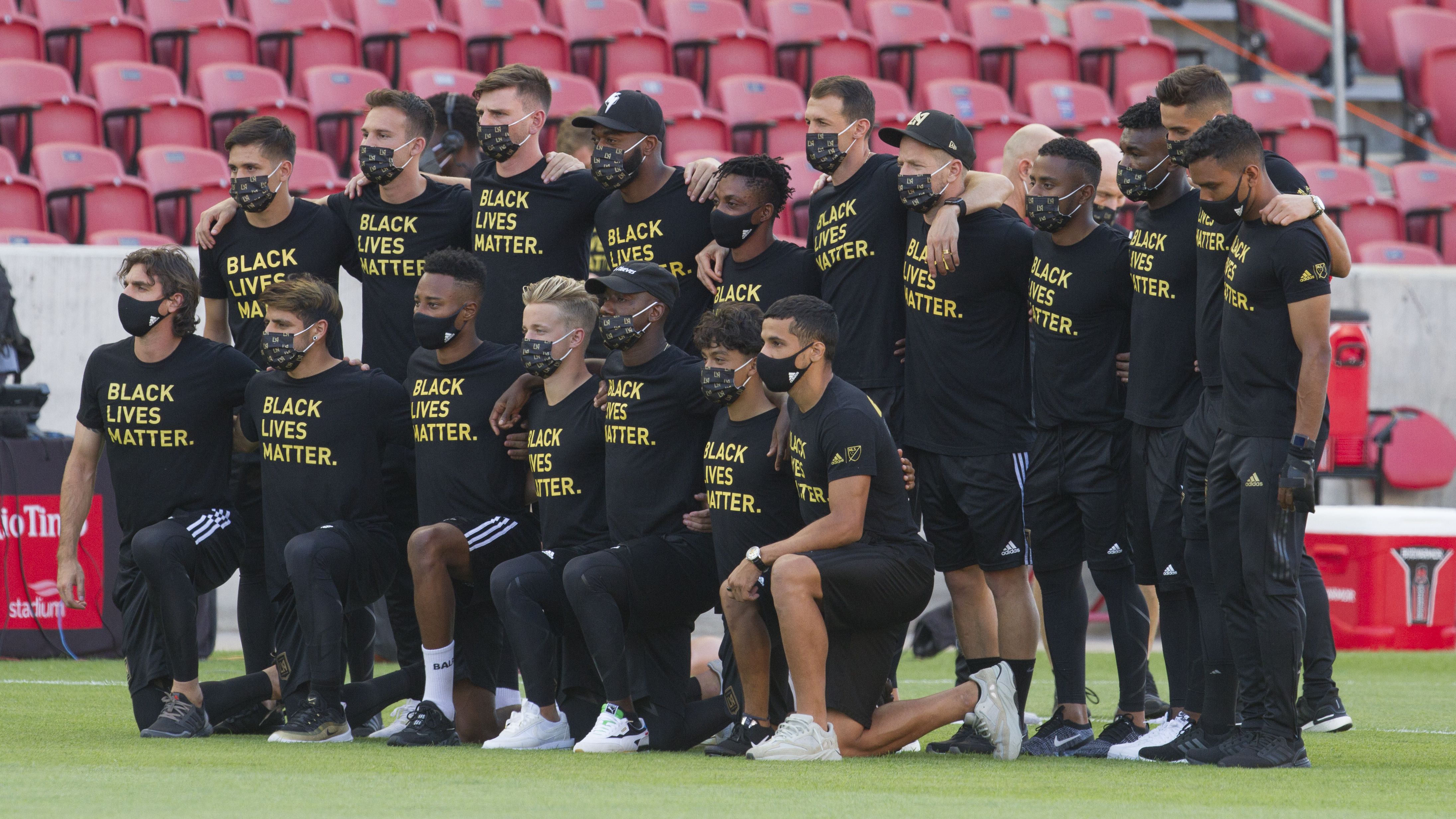 Members of the Los Angeles FC pose for a photograph on the field after their game against Real Salt Lake was postponed at Rio Tinto Stadium on August 26
