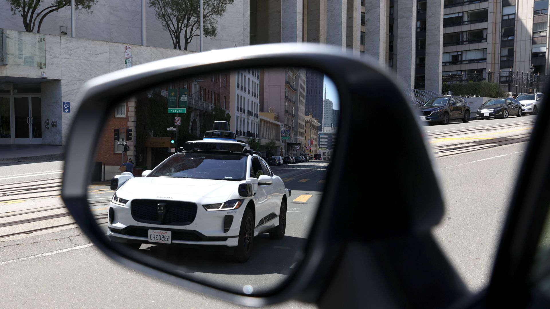 A Waymo vehicle, spotted in a side view mirror in San Francisco. Photo: Justin Sullivan/Getty Images
