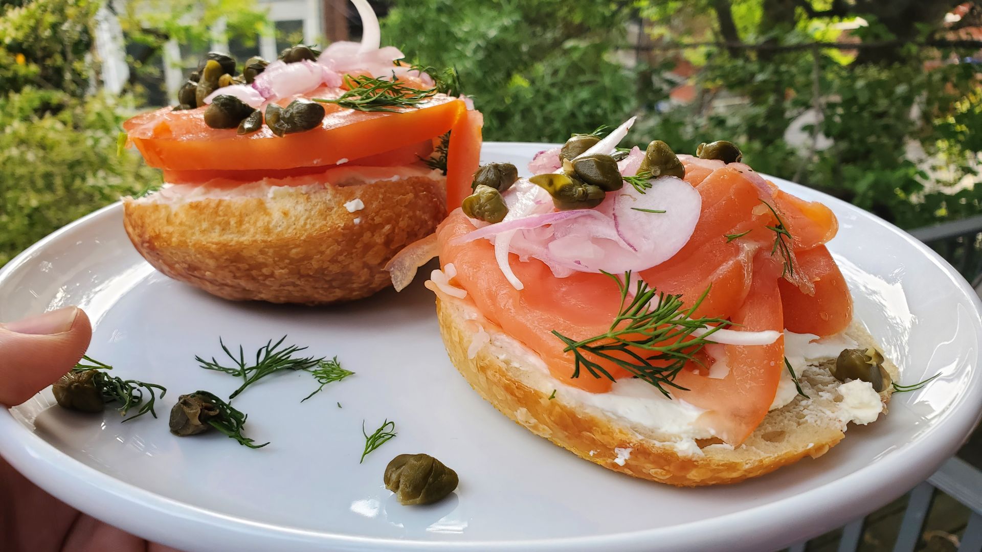 A picture of lox and cream cheese on a bagel.