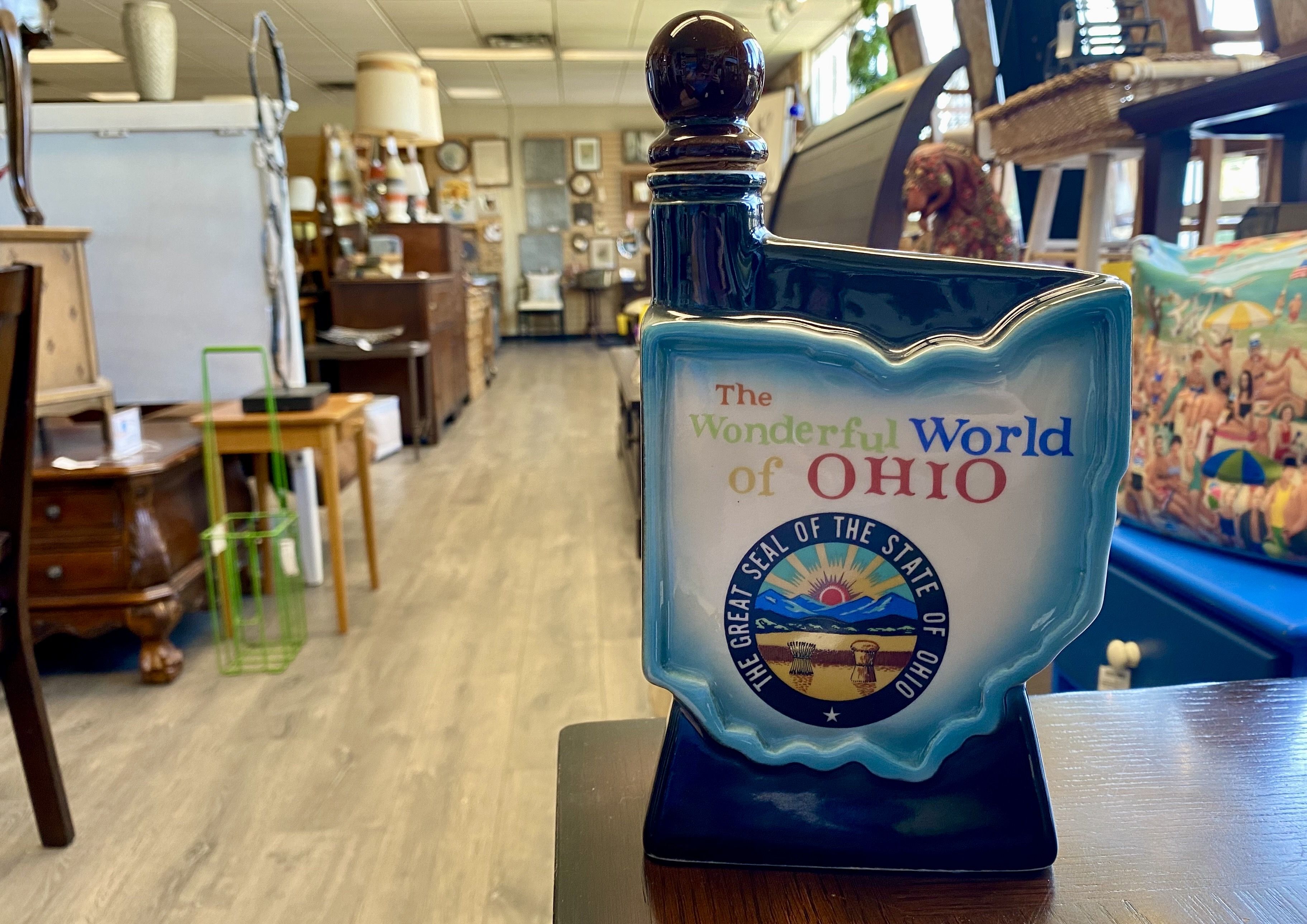 An Ohio-shaped Jim Beam bottle that reads "The Wonderful World of Ohio" above the state seal