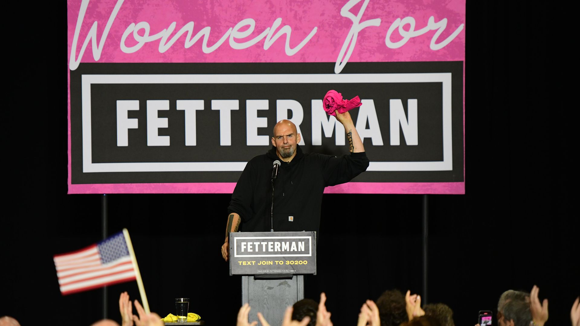 emocratic Pennsylvania Senate nominee John Fetterman prepares to throw a t-shirt that states "FETTERWOMAN" to supporters during a rally.