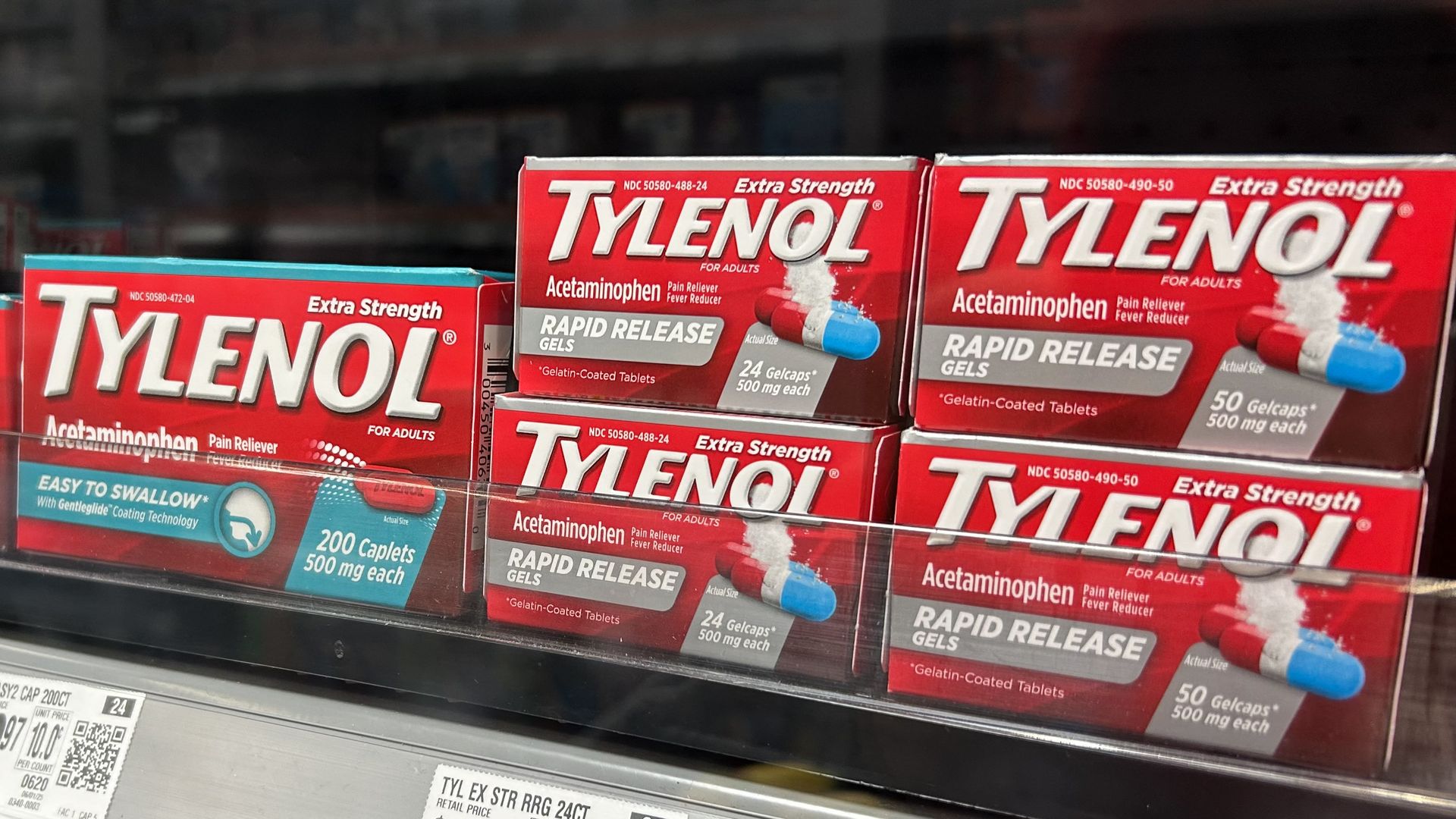 Boxes of Tylenol on a pharmacy shelf. 