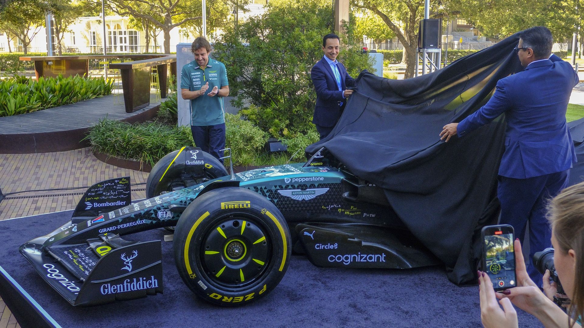 F1 driver Fernando Alonso and Aramco executives unveil new livery for AMF1's car in the U.S. Grand Prix