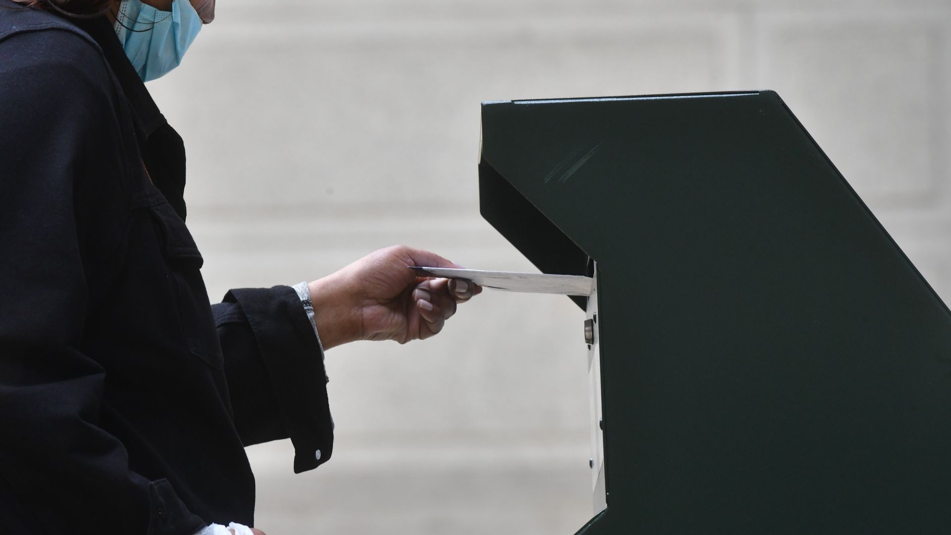 Voter dropping off a mail-in ballot