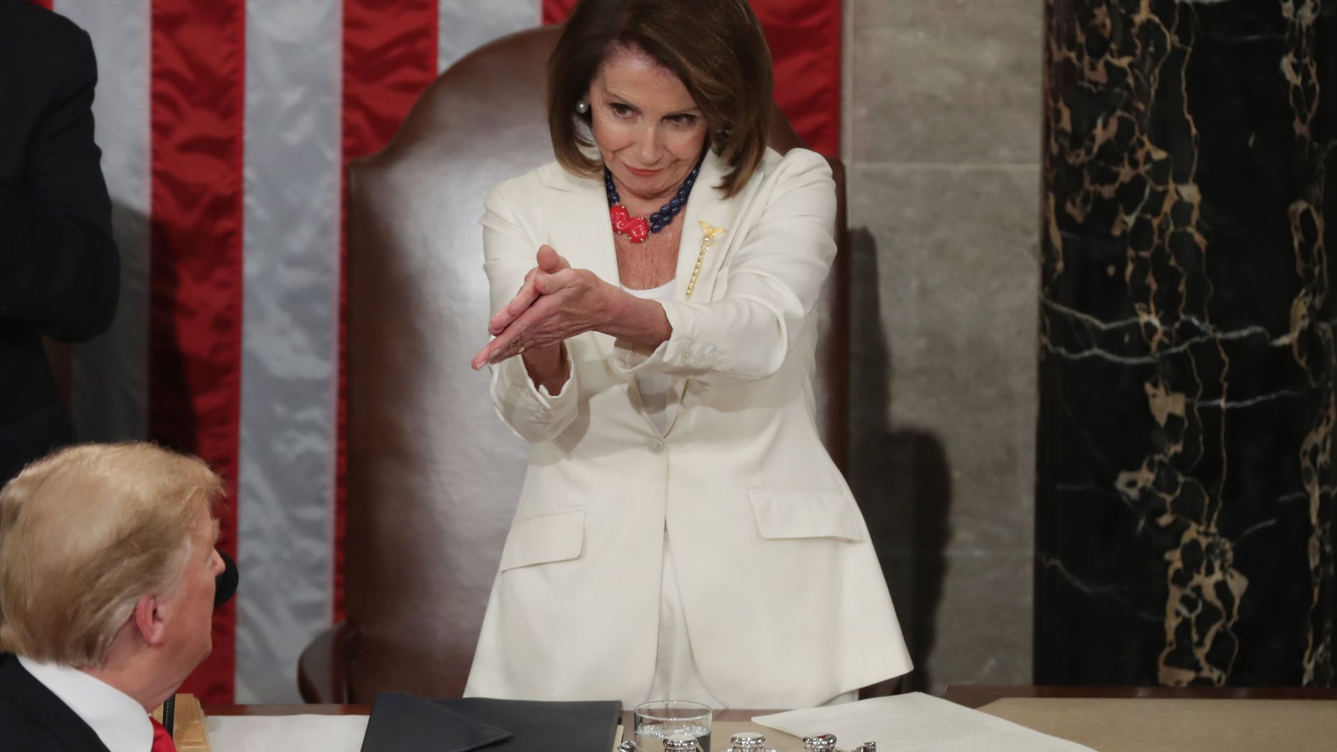Nancy Pelosi claps sarcastically at President Trump.