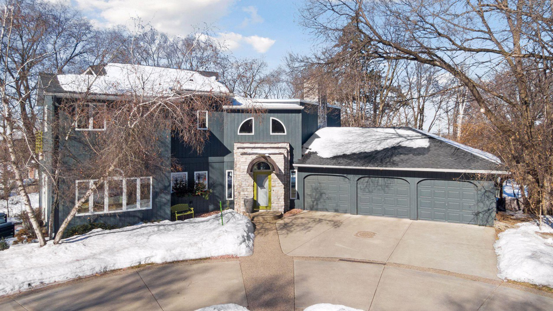 exterior of dark home with white trim