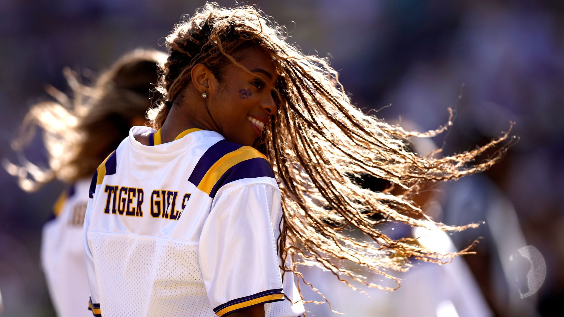 LSU Tigers Girls perform during the fourth quarter of an NCAA game against the Arkansas Razorbacks.