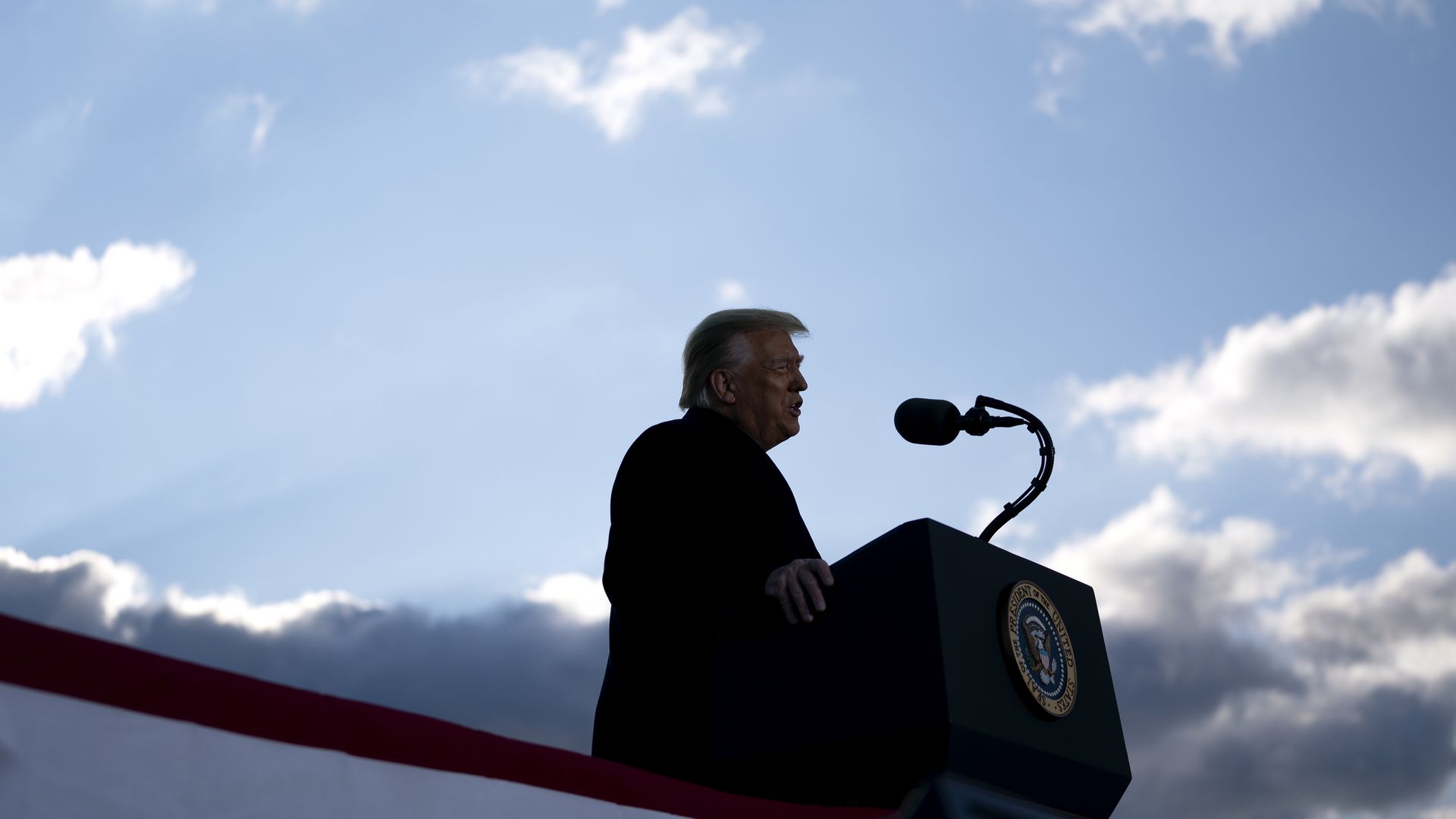 Photo of Donald Trump speaking behind a podium