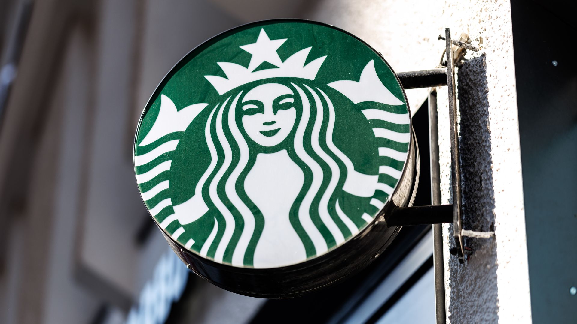 The Starbucks logo attached to a building