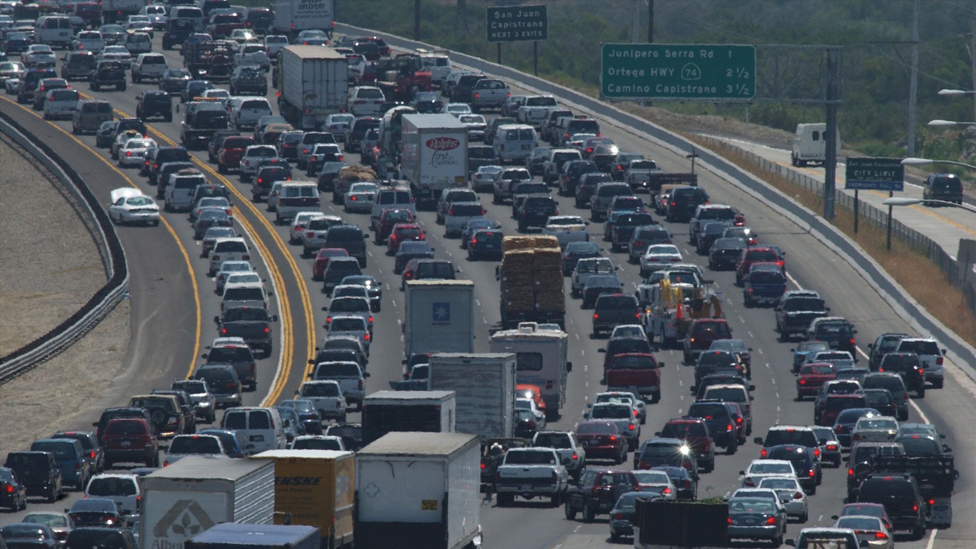 Cars stuck in traffic on large highway