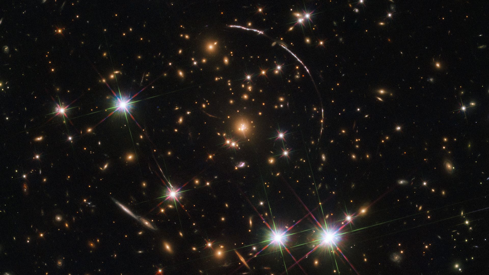 A photo of deep space showing a galaxy's image distorted and magnified