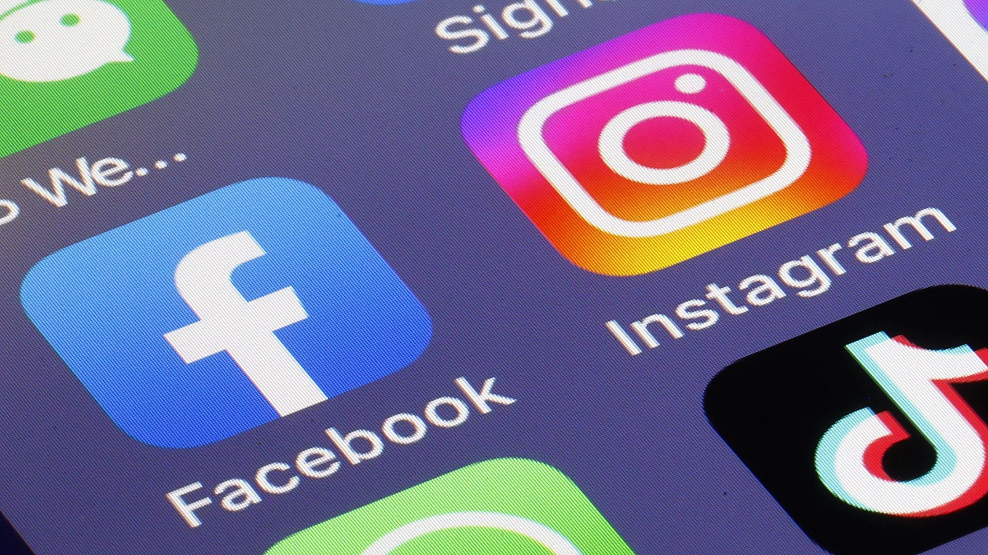 Logos of some social media applications seen on a smartphone screen.