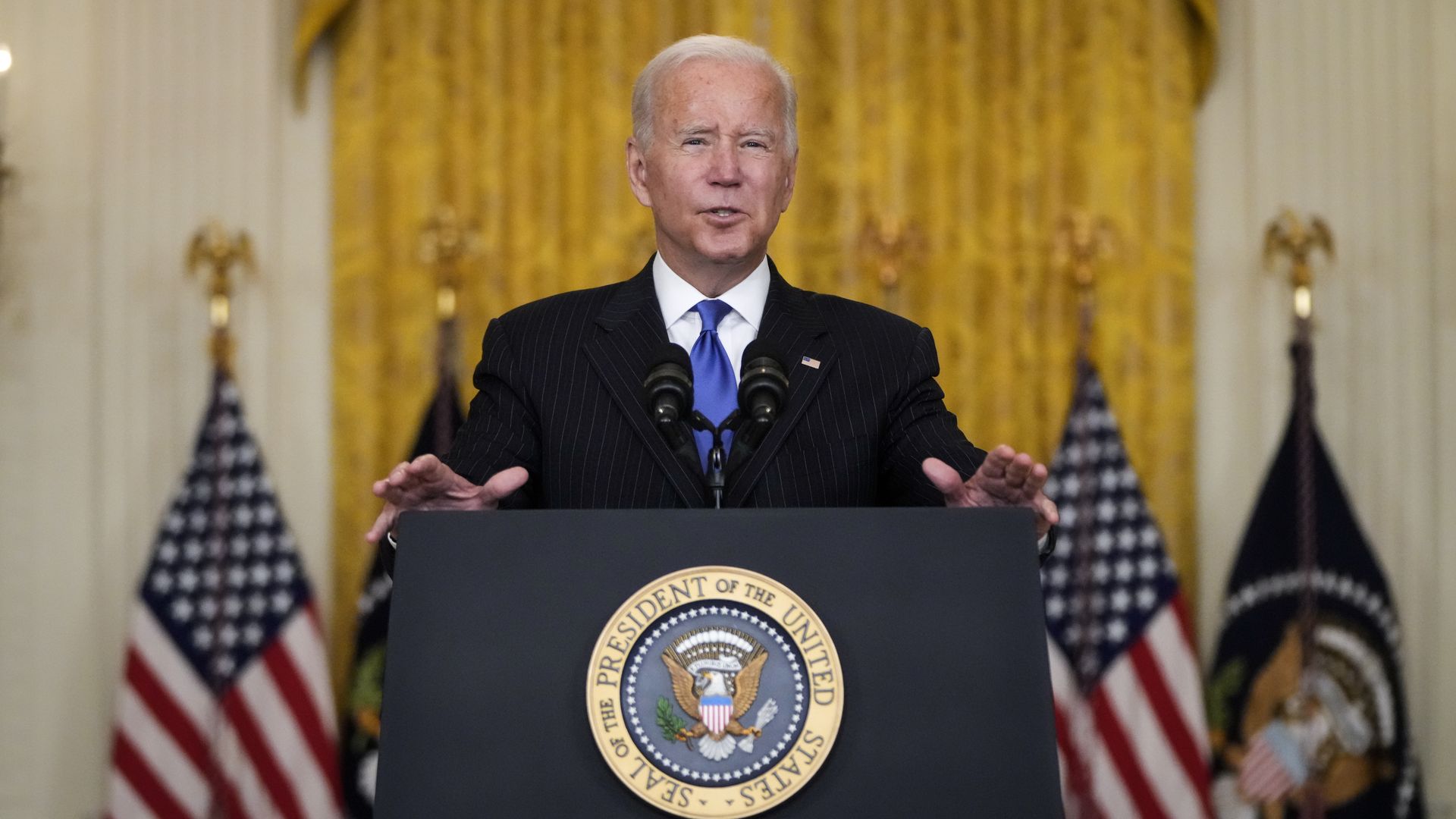 President Biden speaks at lectern