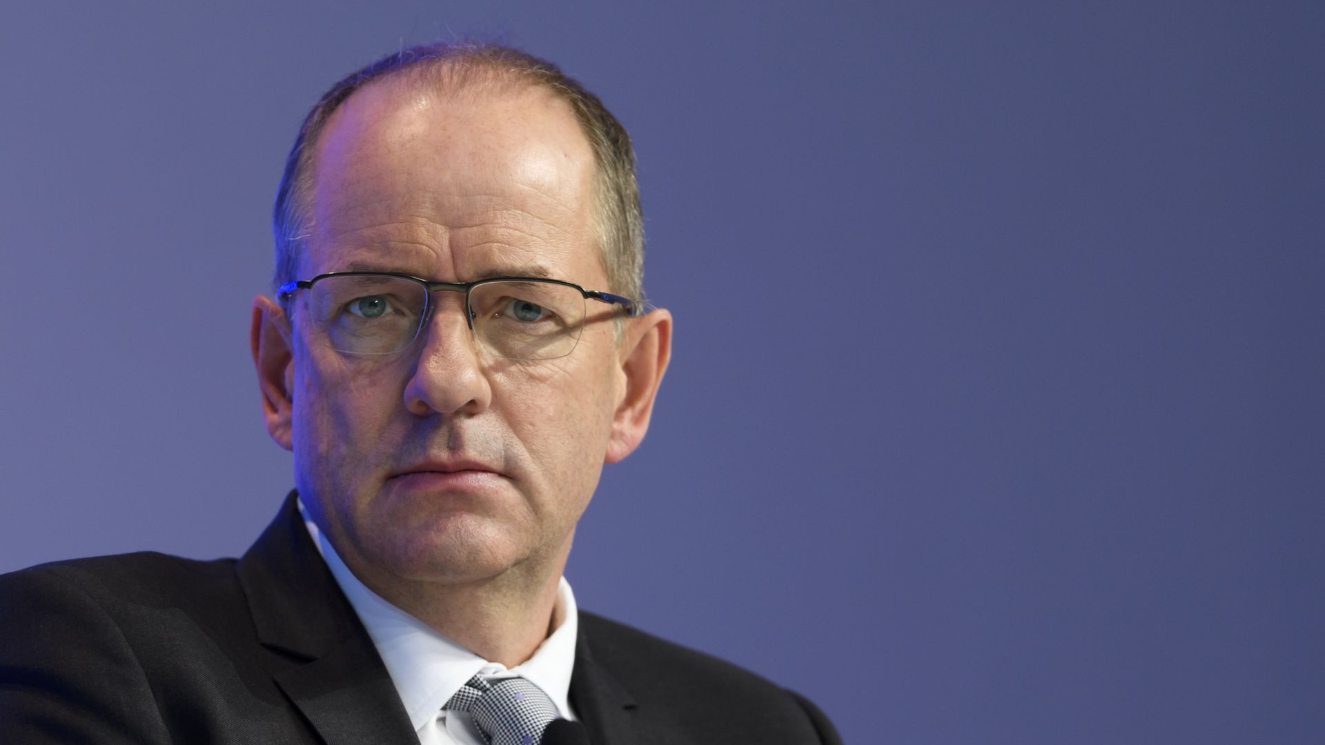 Andrew Witty speaks at an event.