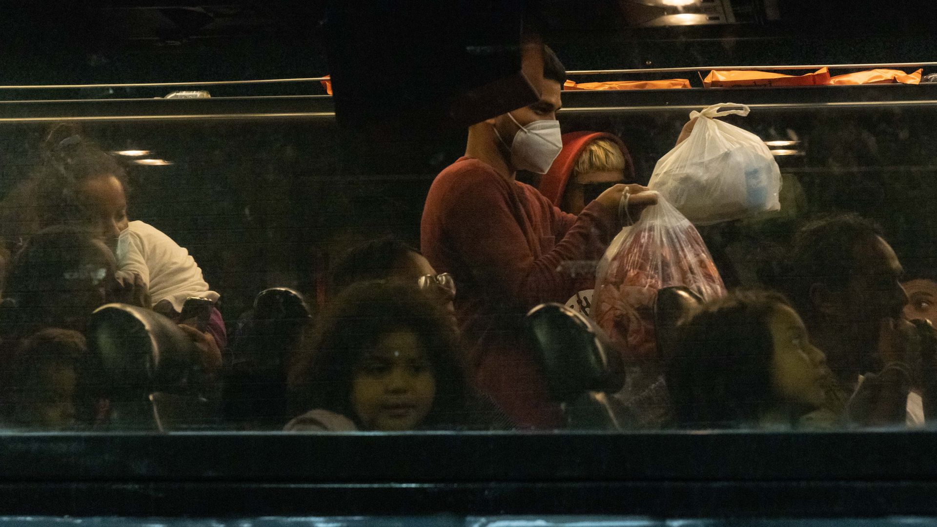Migrants arrive on a bus from Texas to the Port Authority Bus Terminal in New York.