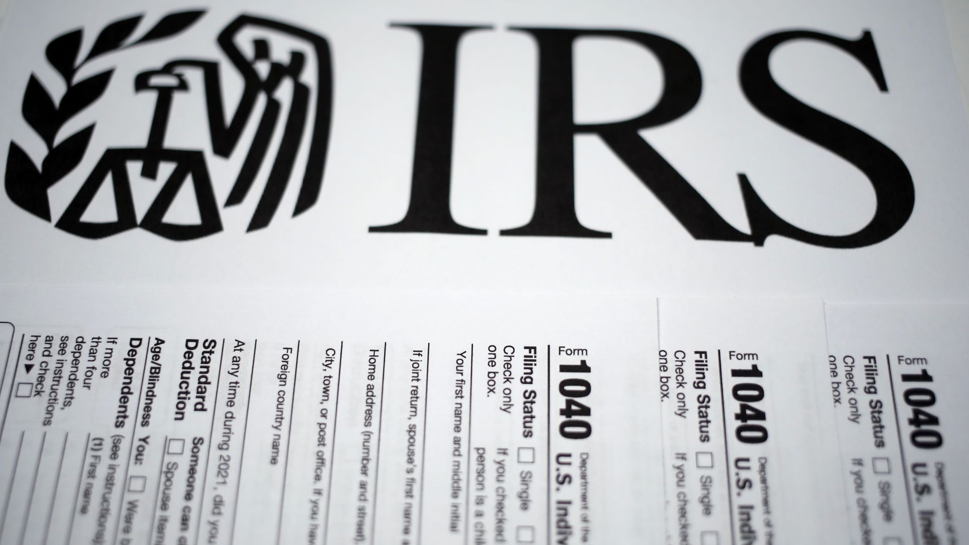 IRS 1040 forms with IRS logo