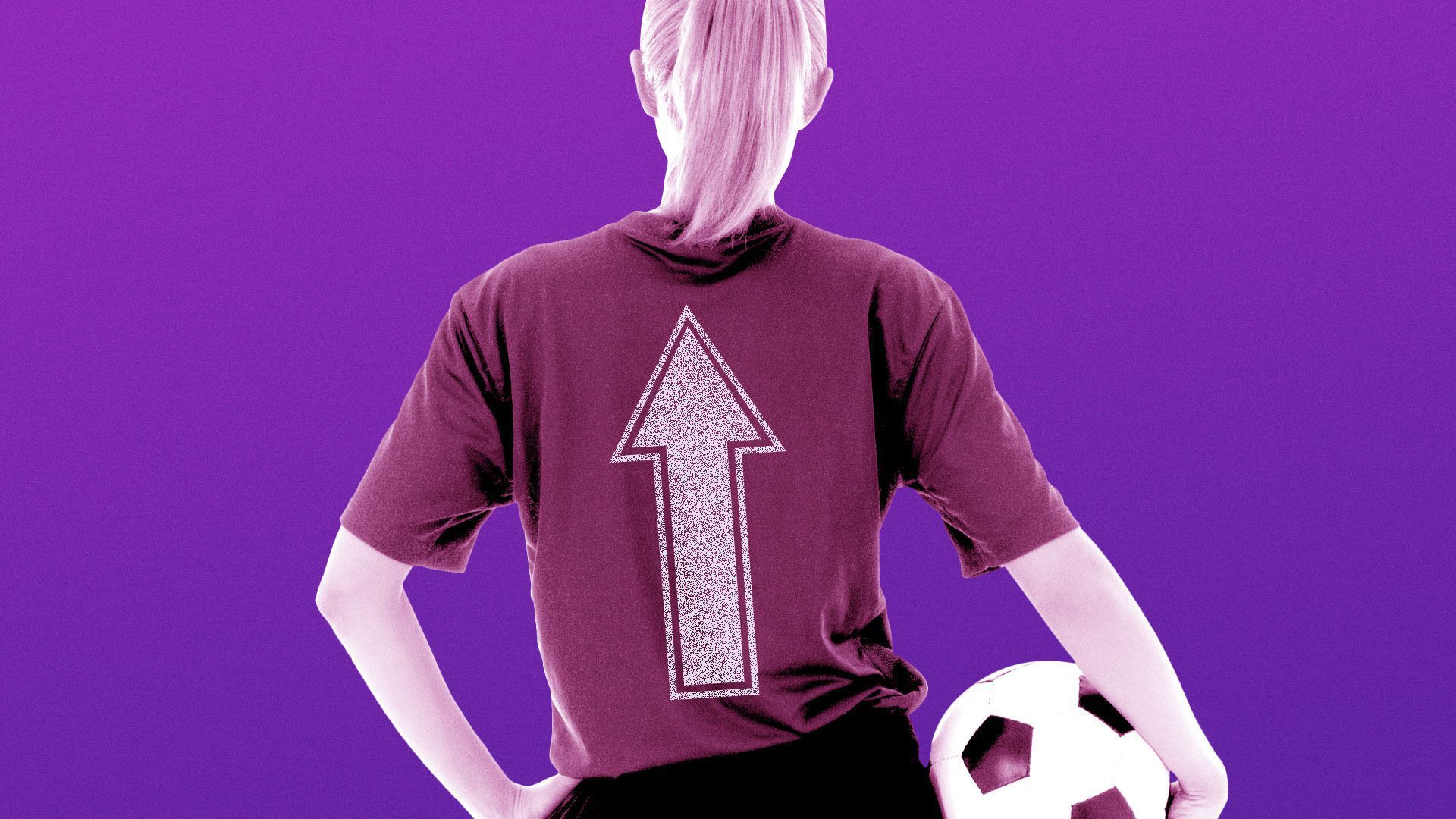 A female soccer player holding a soccer ball. 