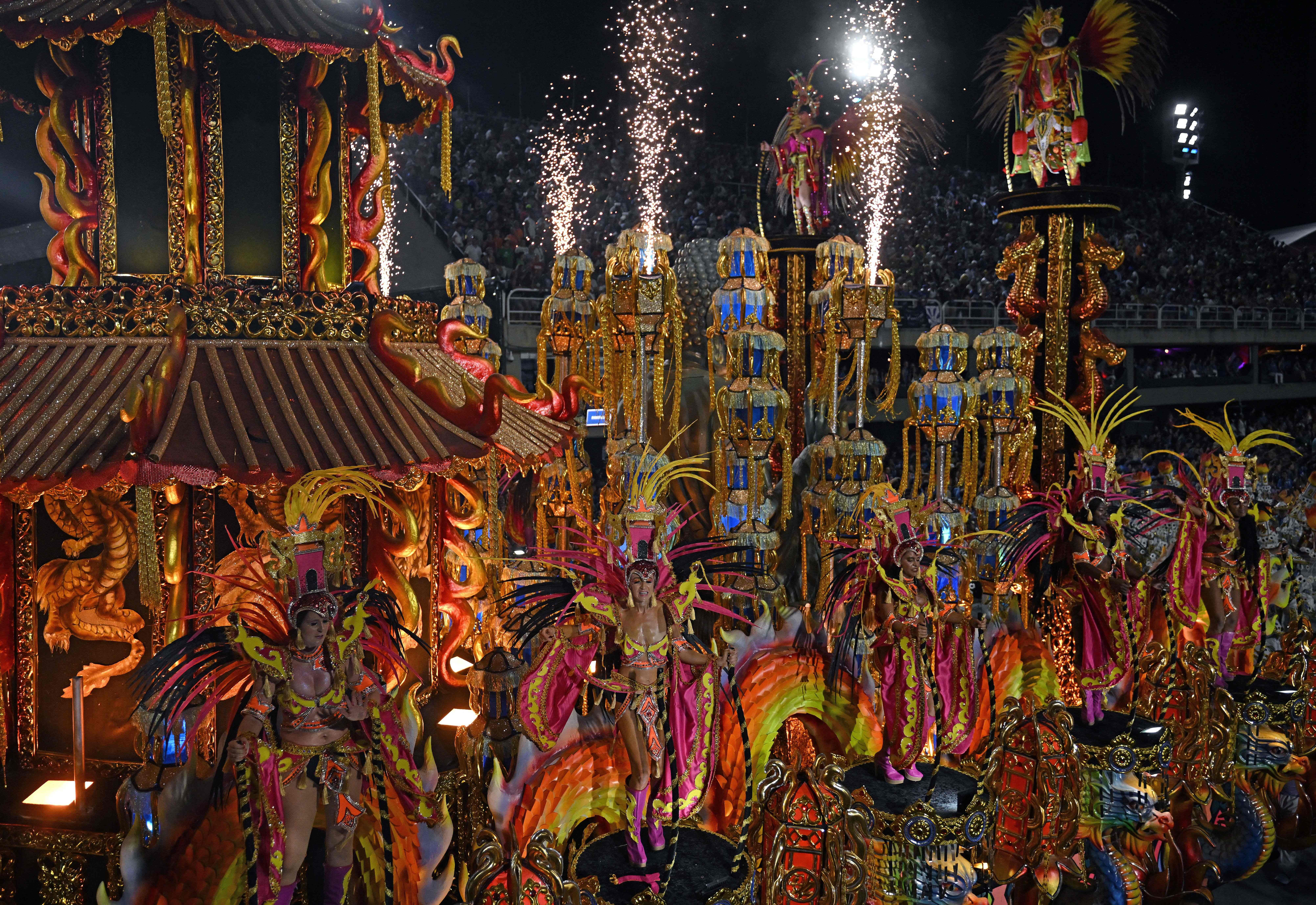 An elaborate and colorful parade float with dancers during Brazil's carnival