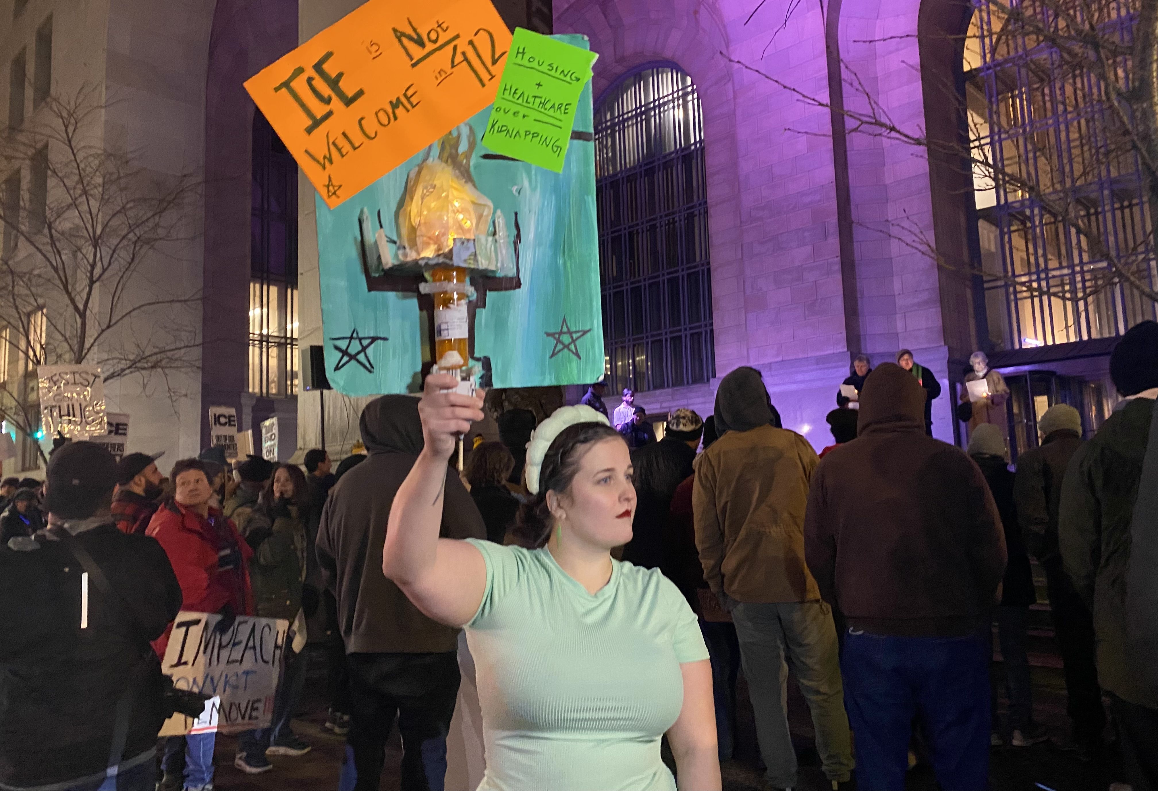 Dozens gathered in Downtown Pittsburgh Thursday night to protest the killing of a woman in Minneapolis by an ICE officer. Photo: Chrissy Suttles/Axios