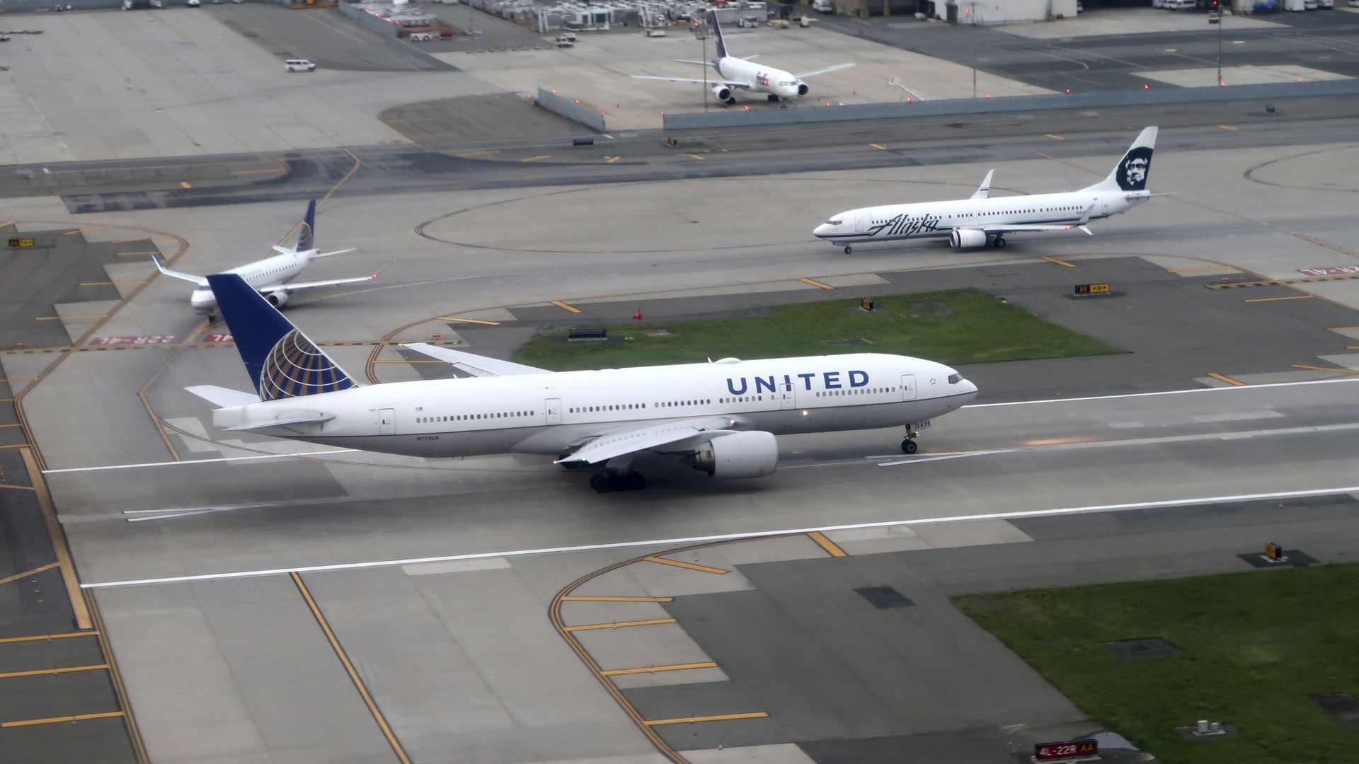Aerial view of airport runway with a plane on it
