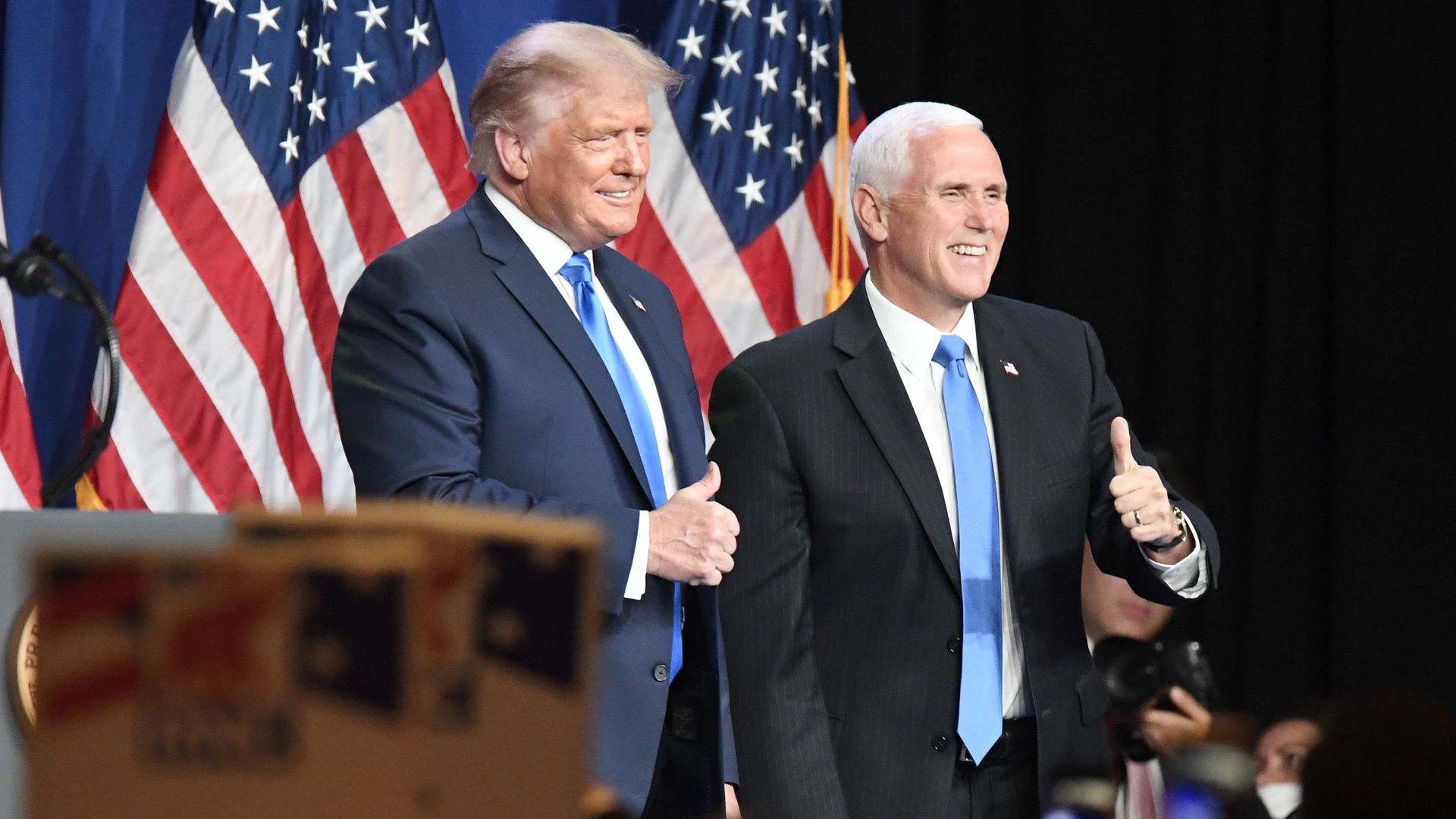 President Trump and Vice President Mike Pence smile and give thumbs up at the Republican convention