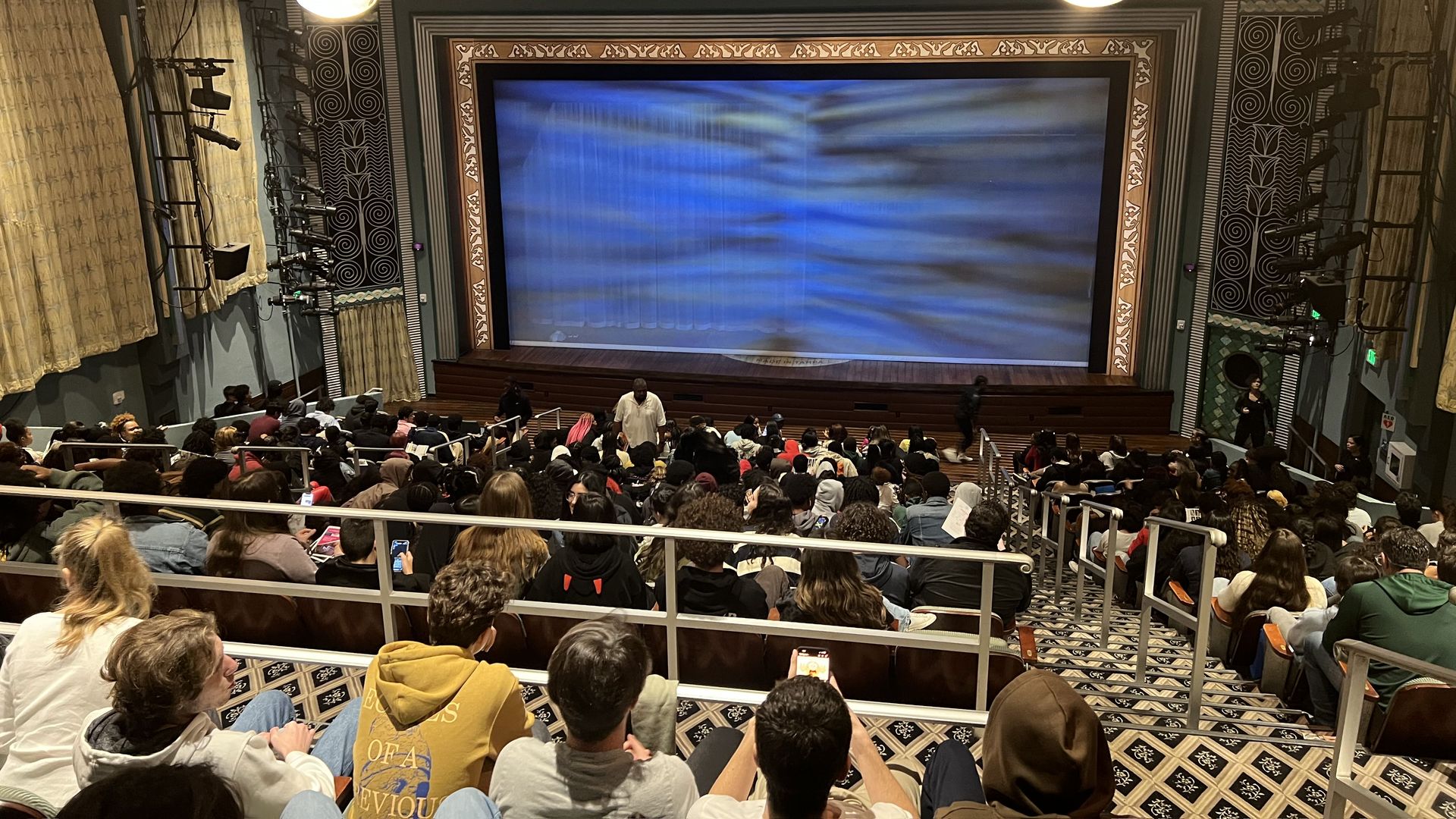 High-school students watching a showing of the play "Anna in the Tropics" at the theater Miami New Drama.