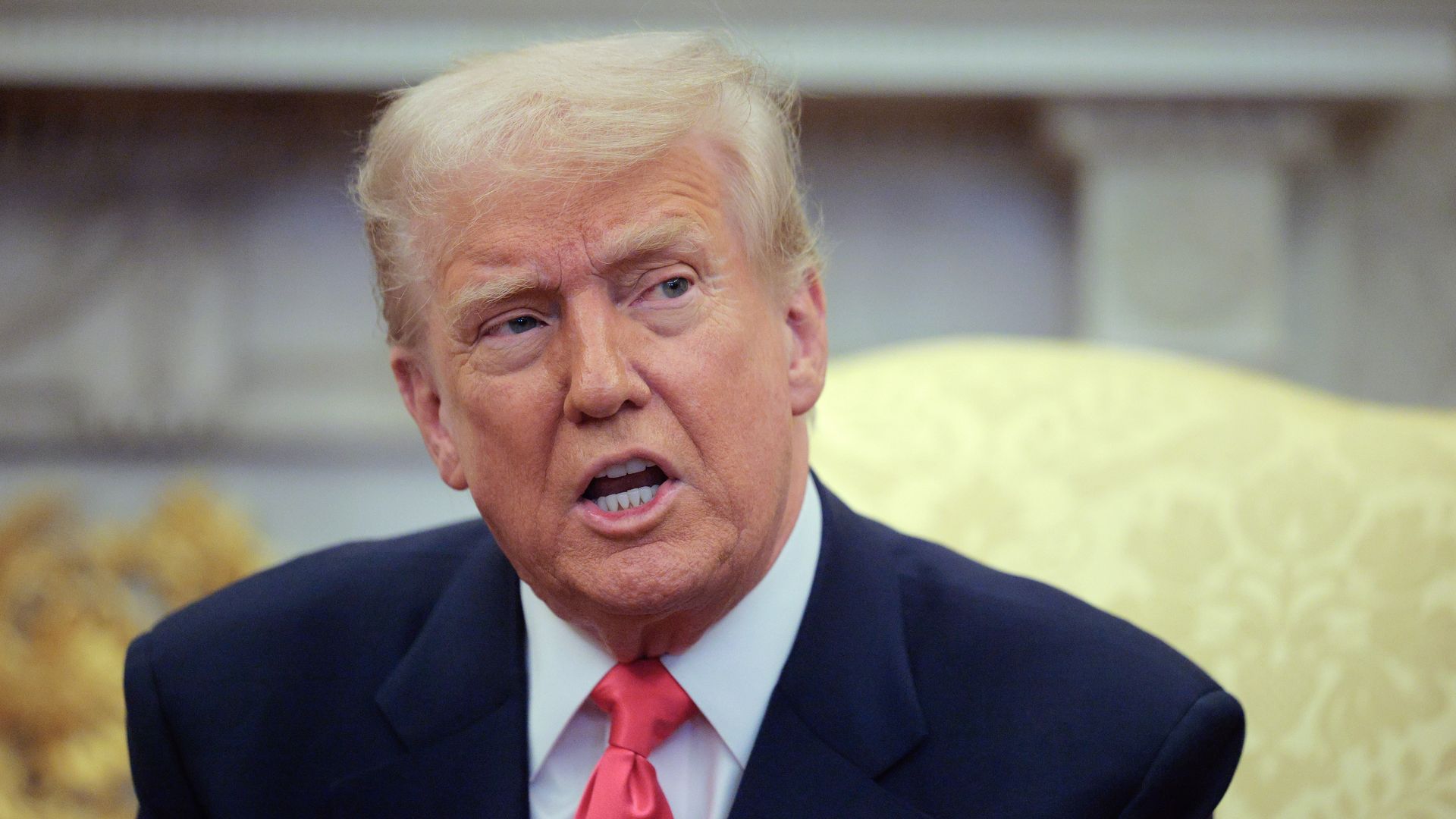 .S. President Donald Trump answers reporters' questions while hosting Irish Taoiseach Micheal Martin in the Oval Office at the White House on March 12, 2025 in Washington, DC. 