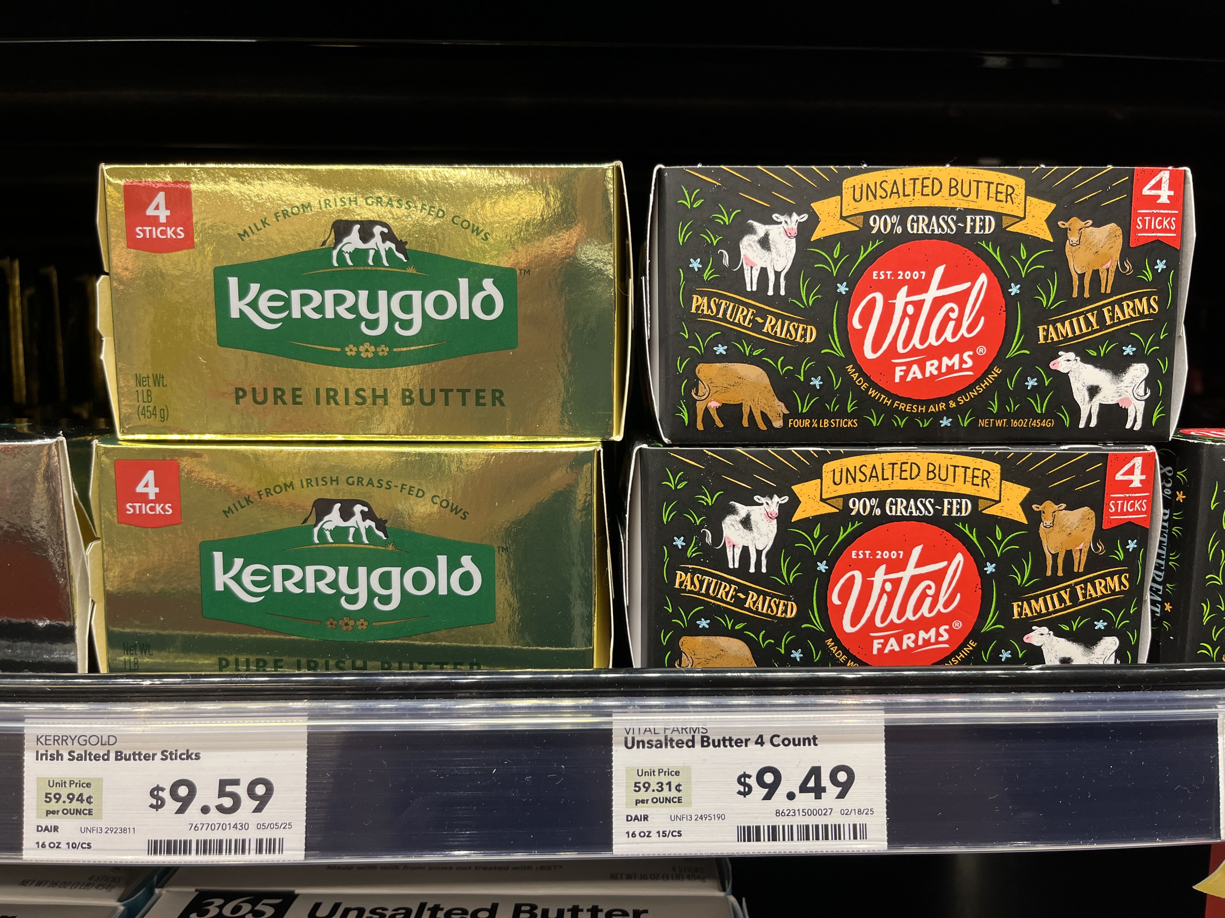 Kerrygold Pure Irish Butter in gold packaging and Vital Farms Unsalted Butter in black packaging with cow illustrations, each with 4 sticks, displayed on grocery shelf with prices.