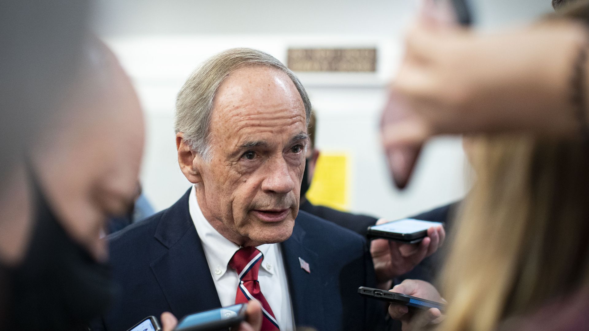 Senator Tom Carper talks to reporters