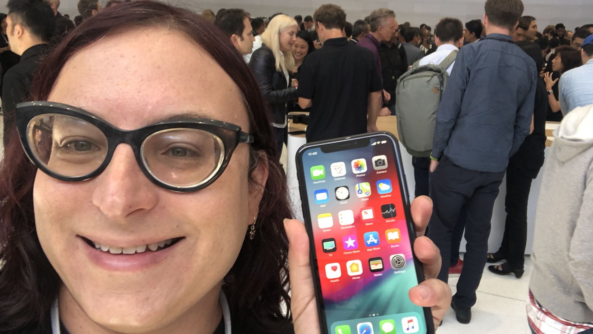 Axios' Ina Fried holding an iPhone Xs at Apple's launch event