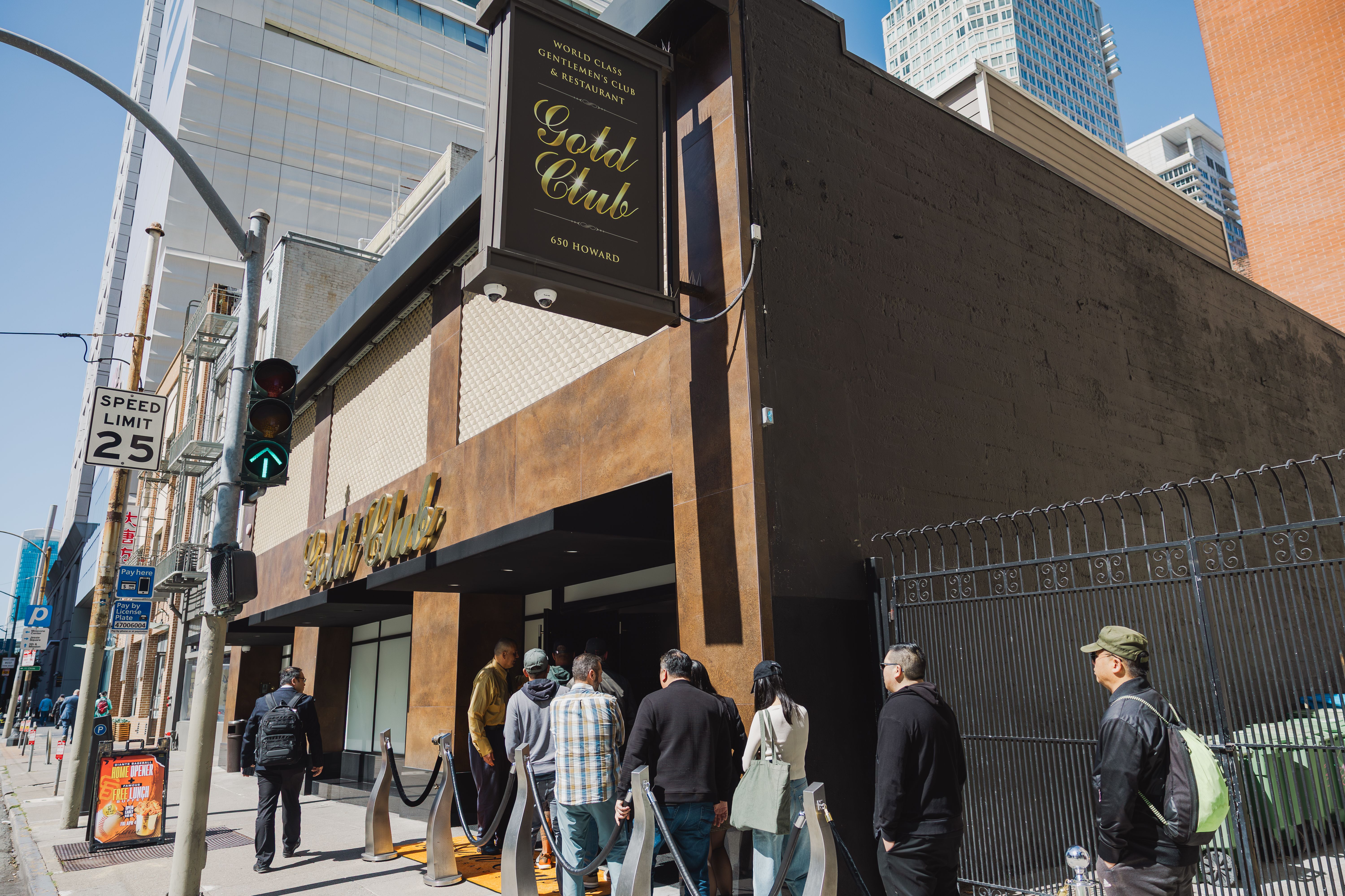 People wait in line to enter the Gold Club's buffet.