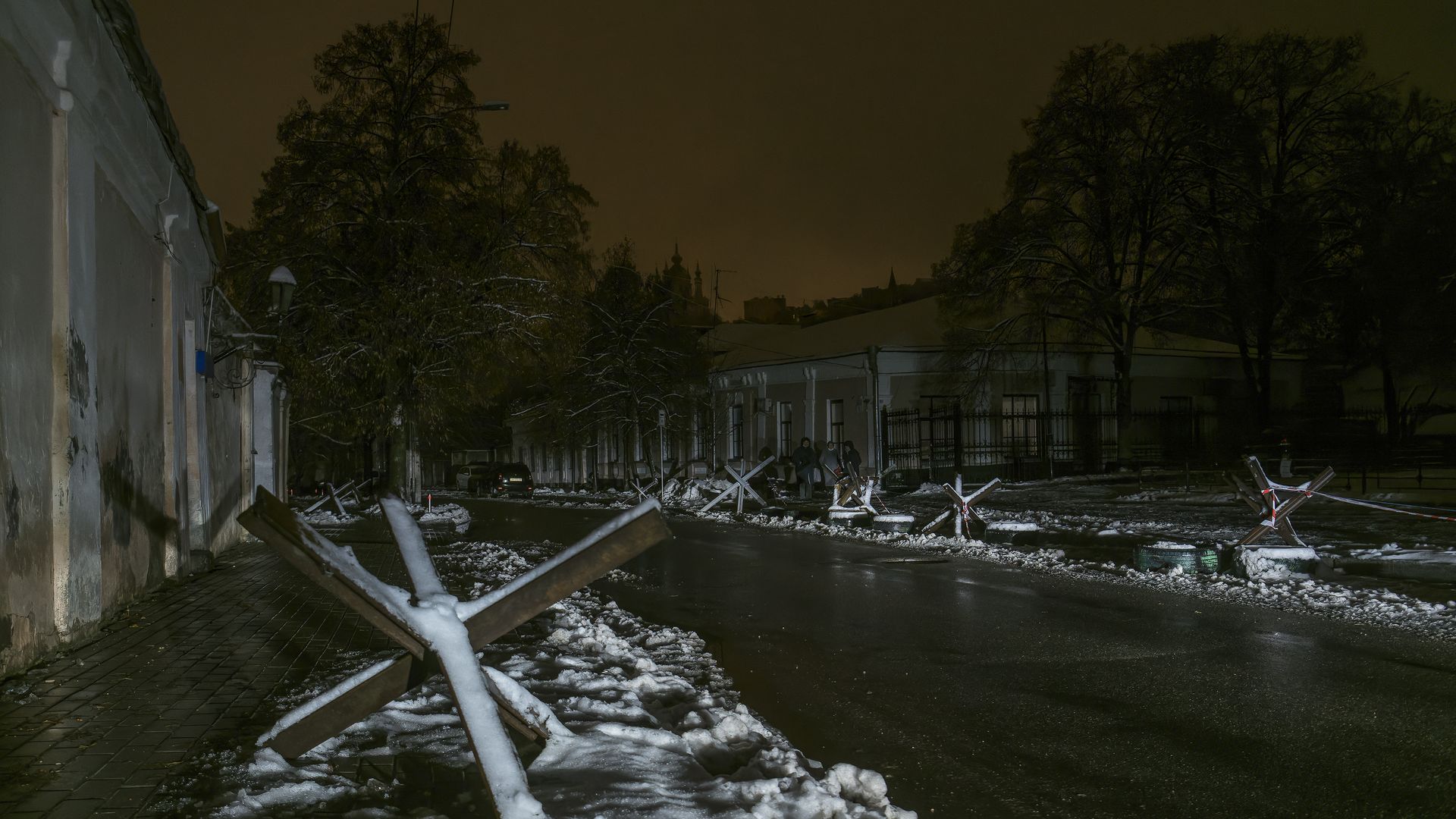 Street with anti-tank obstacle defense during a blackout after a Russian missile attack on Ukrainian power infrastructure in Kyiv