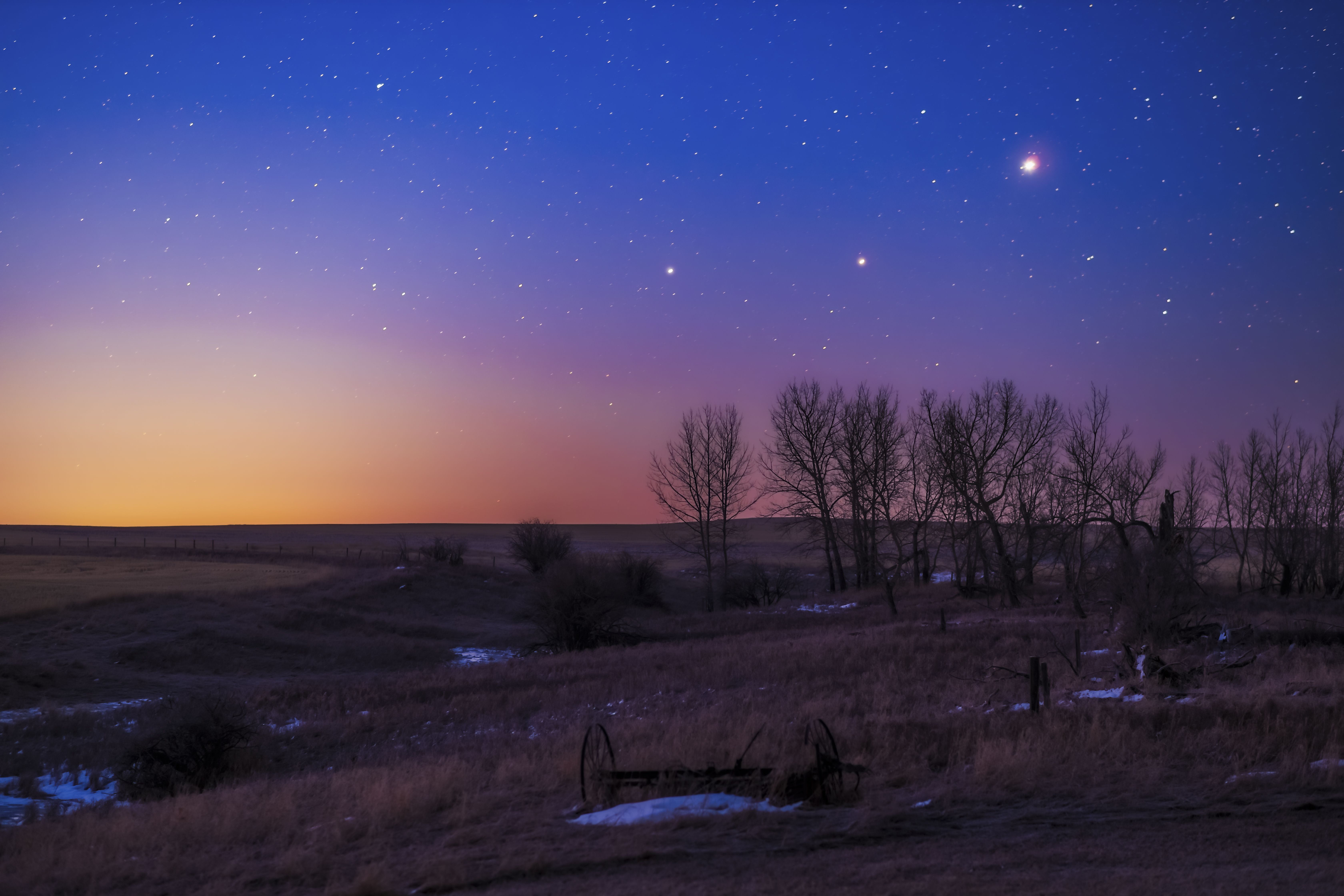 Night sky with stars and three big spots of light