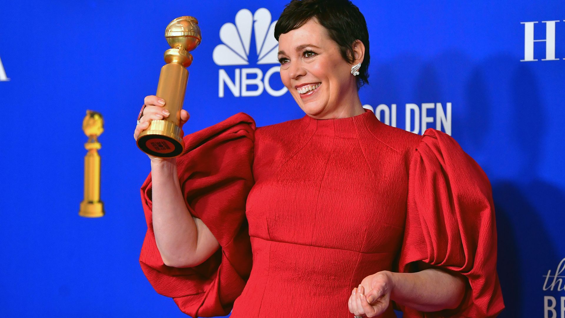 Actress Olivia Colman poses with the 2020 Golden Globe Award she won for her portrayal of Queen Elizabeth in "The Crown."