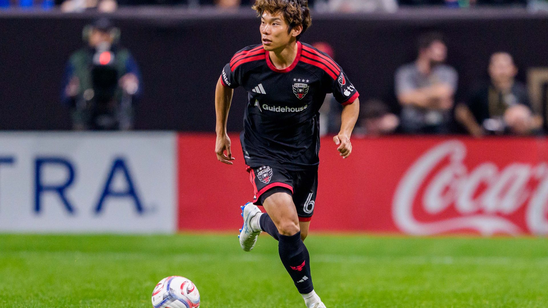 D.C. United defender Keisuke Kurokawa dribbles on the pitch.
